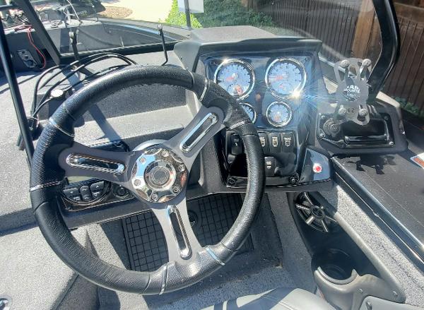 2024 Tracker Targa V-19 WT boat dashboard with steering wheel and instrument panel.