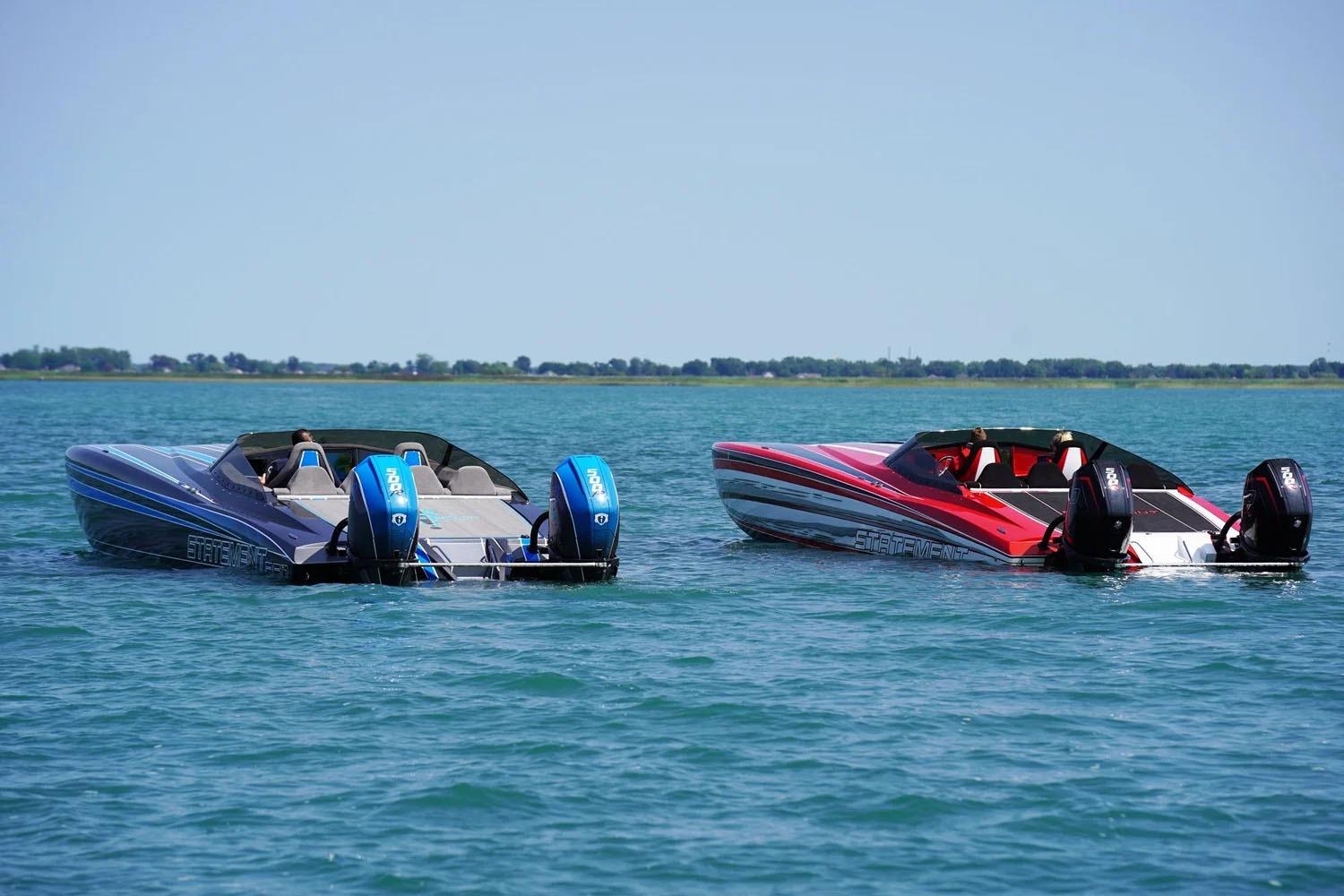 Manufacturer Provided Image: Two Statement 360 CAT boats on a calm lake, showcasing sleek design and powerful engines.