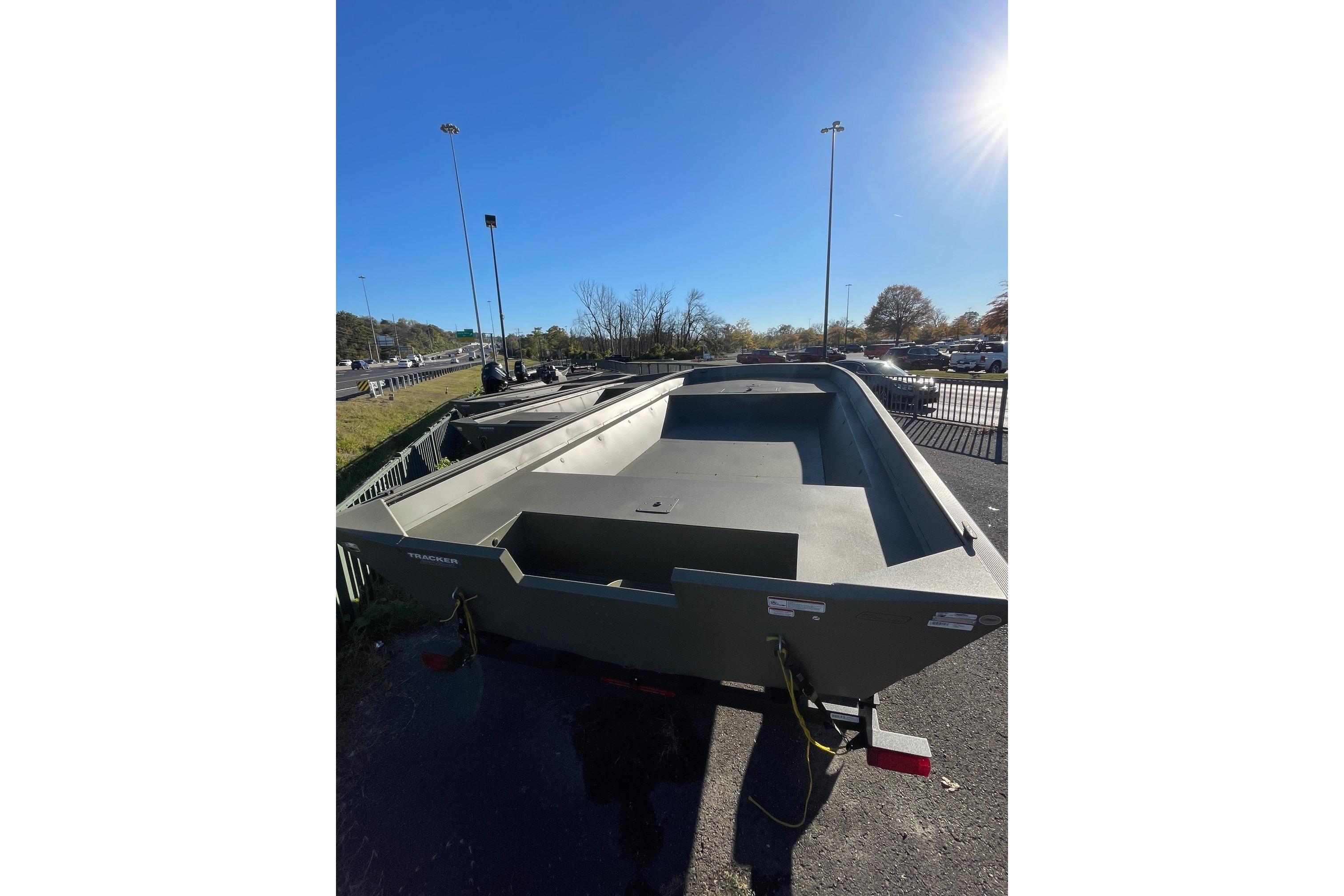2025 Tracker Grizzly 2072 Utility boat parked outdoors under clear blue sky.