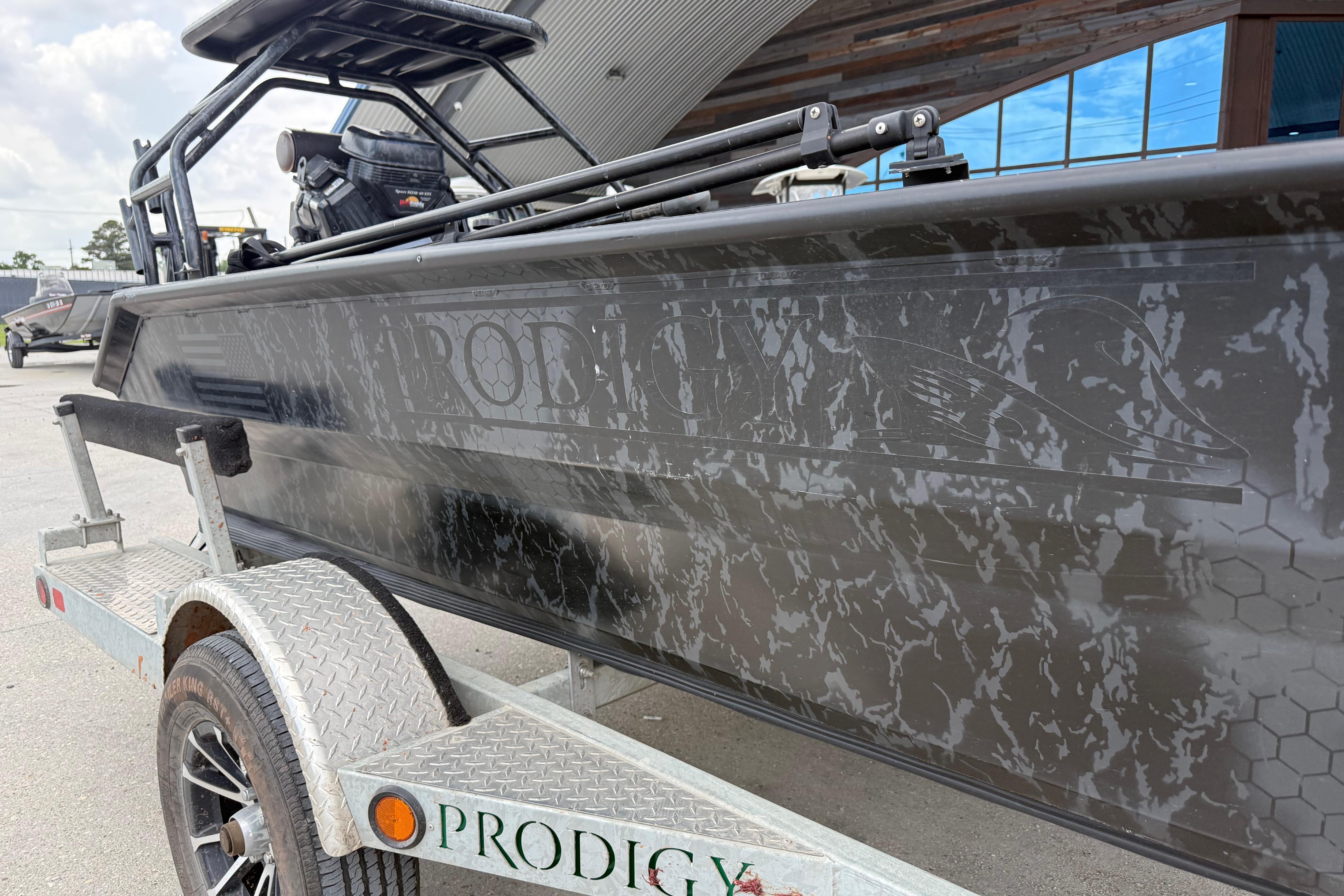 2024 Prodigy 17 boat on trailer, featuring sleek design and camouflage pattern.