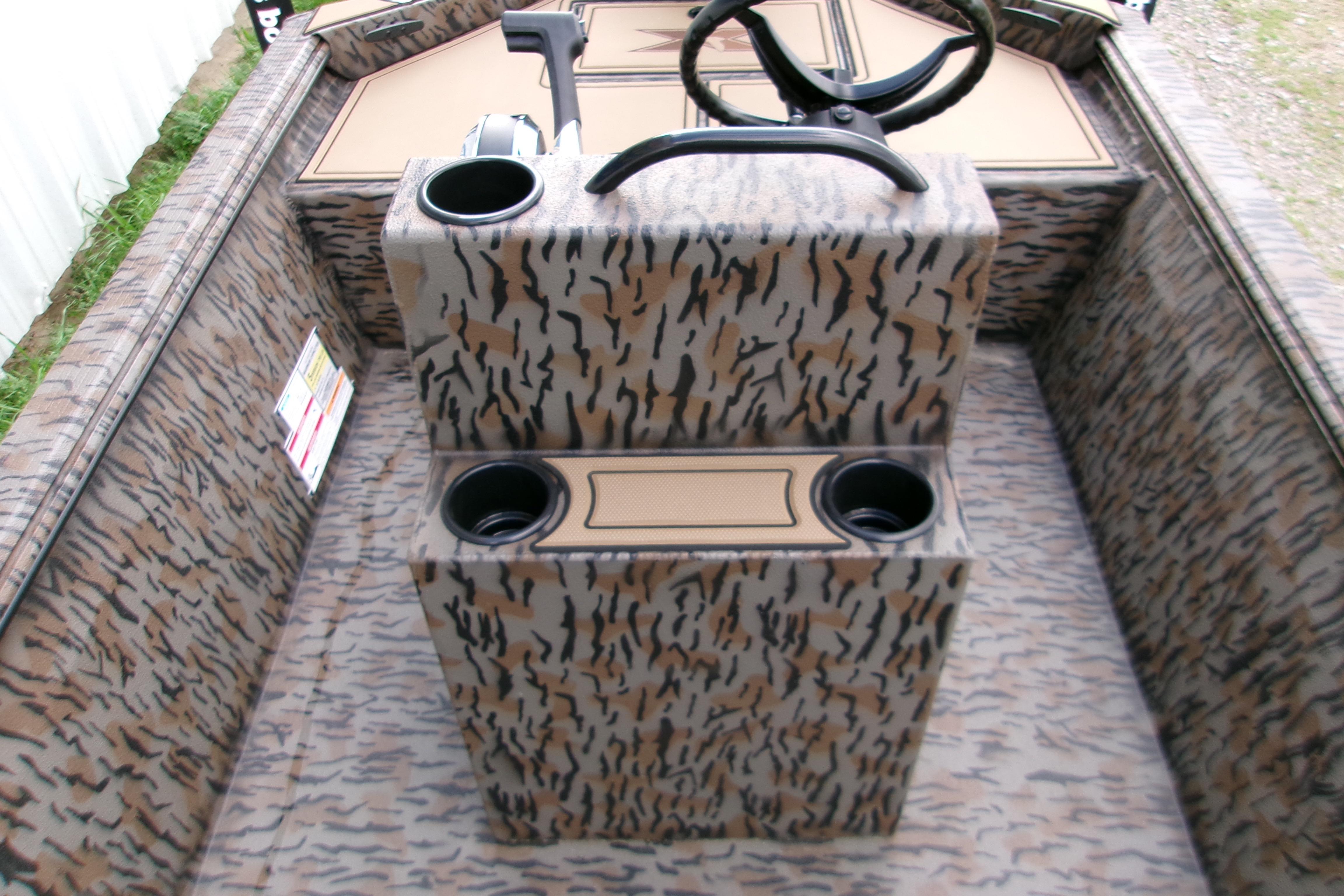 2026 Xpress Bayou 180CC boat interior with camouflage design and steering console.