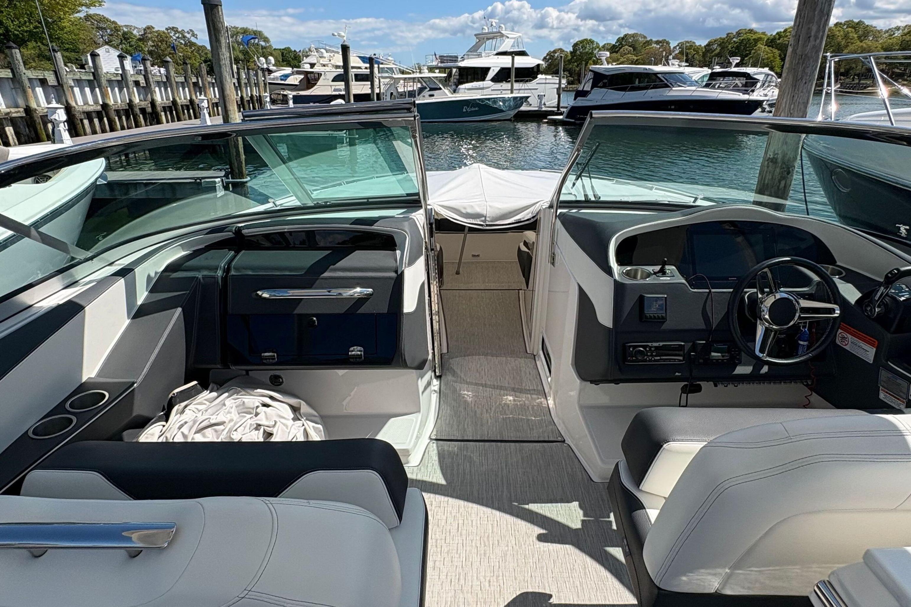 2020 Regal 33 OBX boat interior with modern helm and seating at marina.