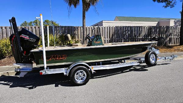 2025 Mako 18 Pro Skiff Backwater Edition on trailer, parked outdoors.