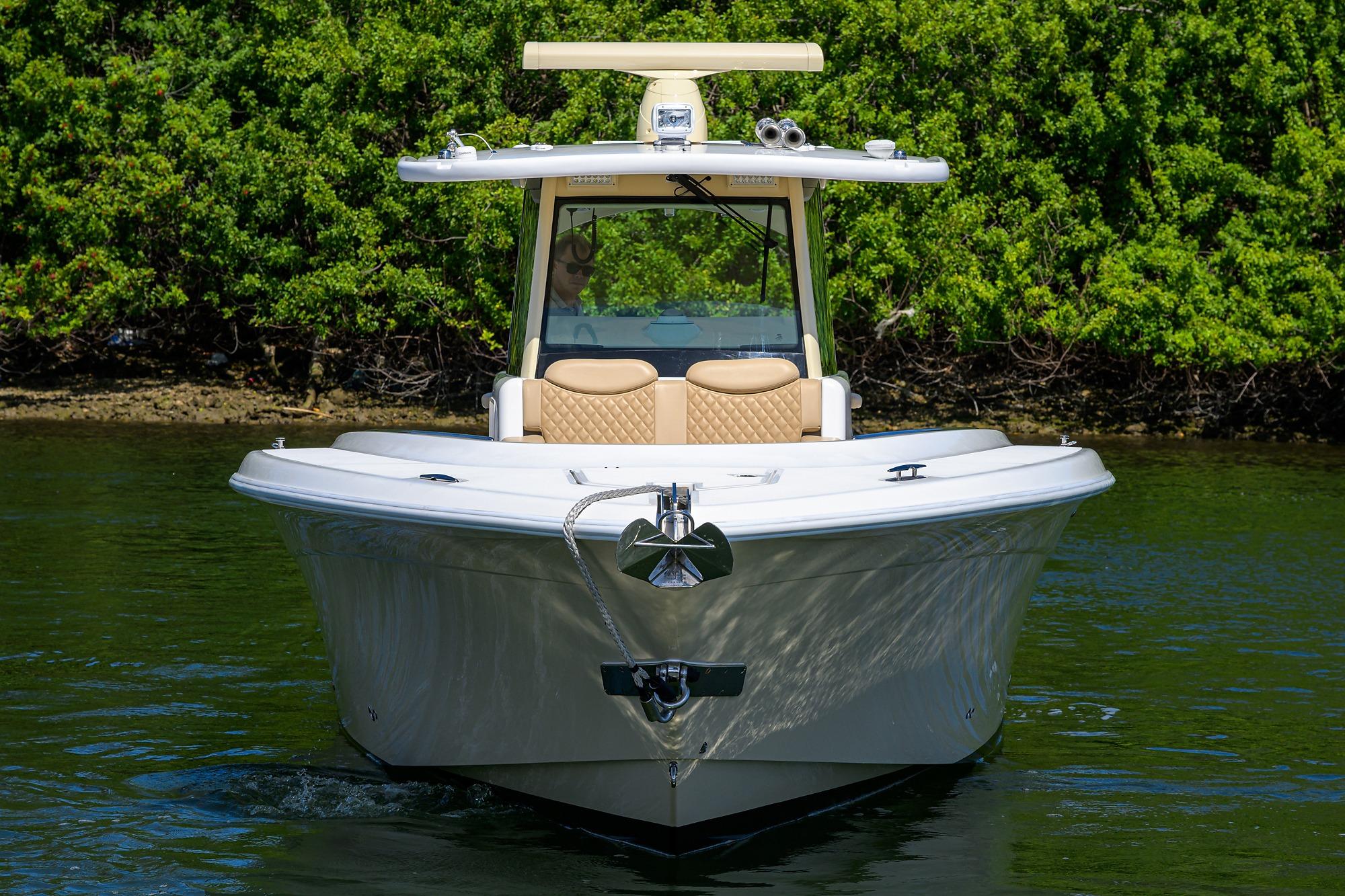 2024 HCB 39 Speciale boat on water, lush greenery background.