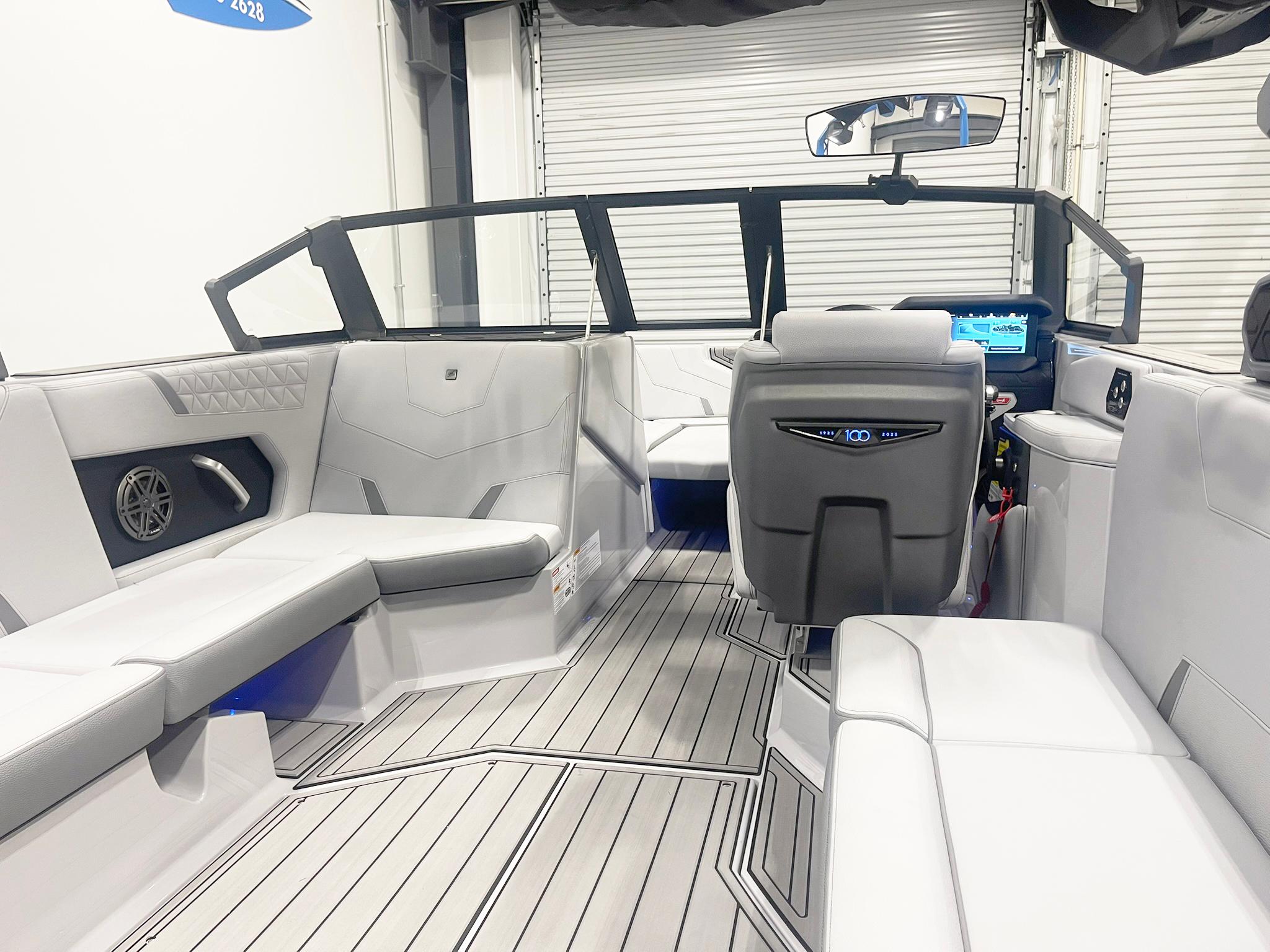 Interior of 2025 Nautique Super Air Nautique GS24 boat, featuring sleek seating and modern dashboard.