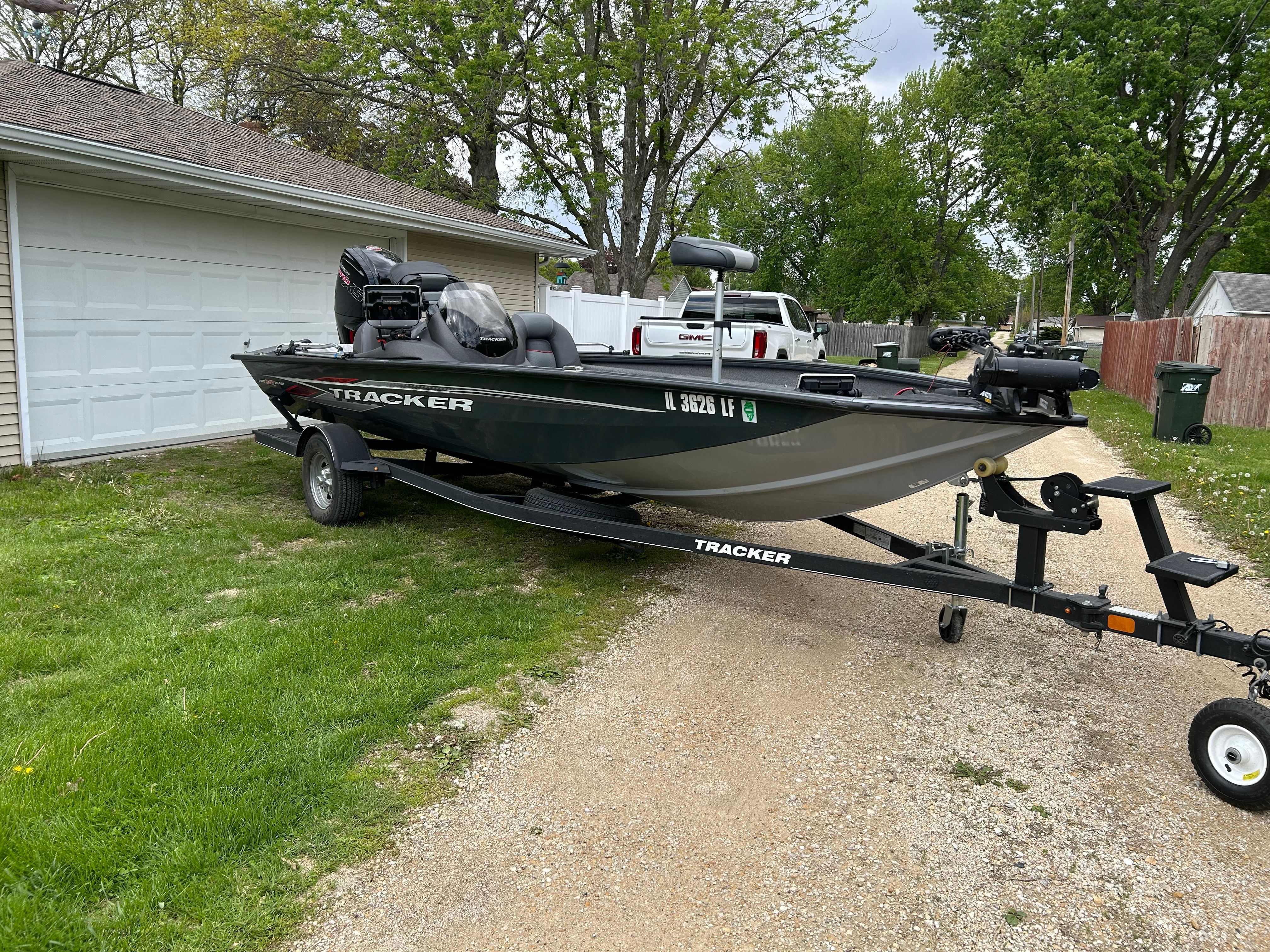 2021 Tracker Pro Team 190 TX boat on trailer in driveway.