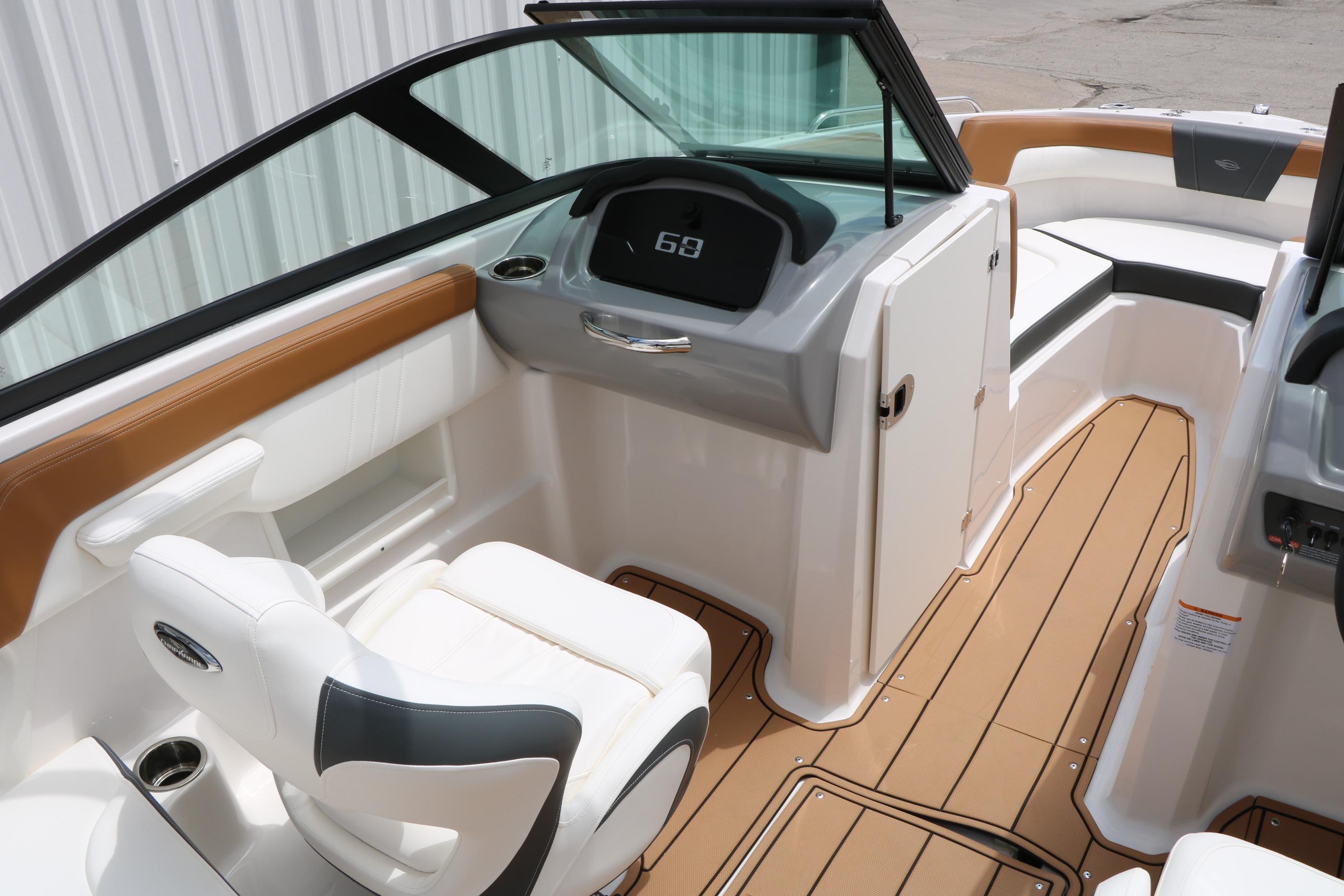 2025 Chaparral 23 SSi boat interior with modern dashboard and comfortable seating.