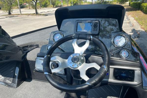 2024 Nitro Z19 boat dashboard with steering wheel, gauges, and navigation system.