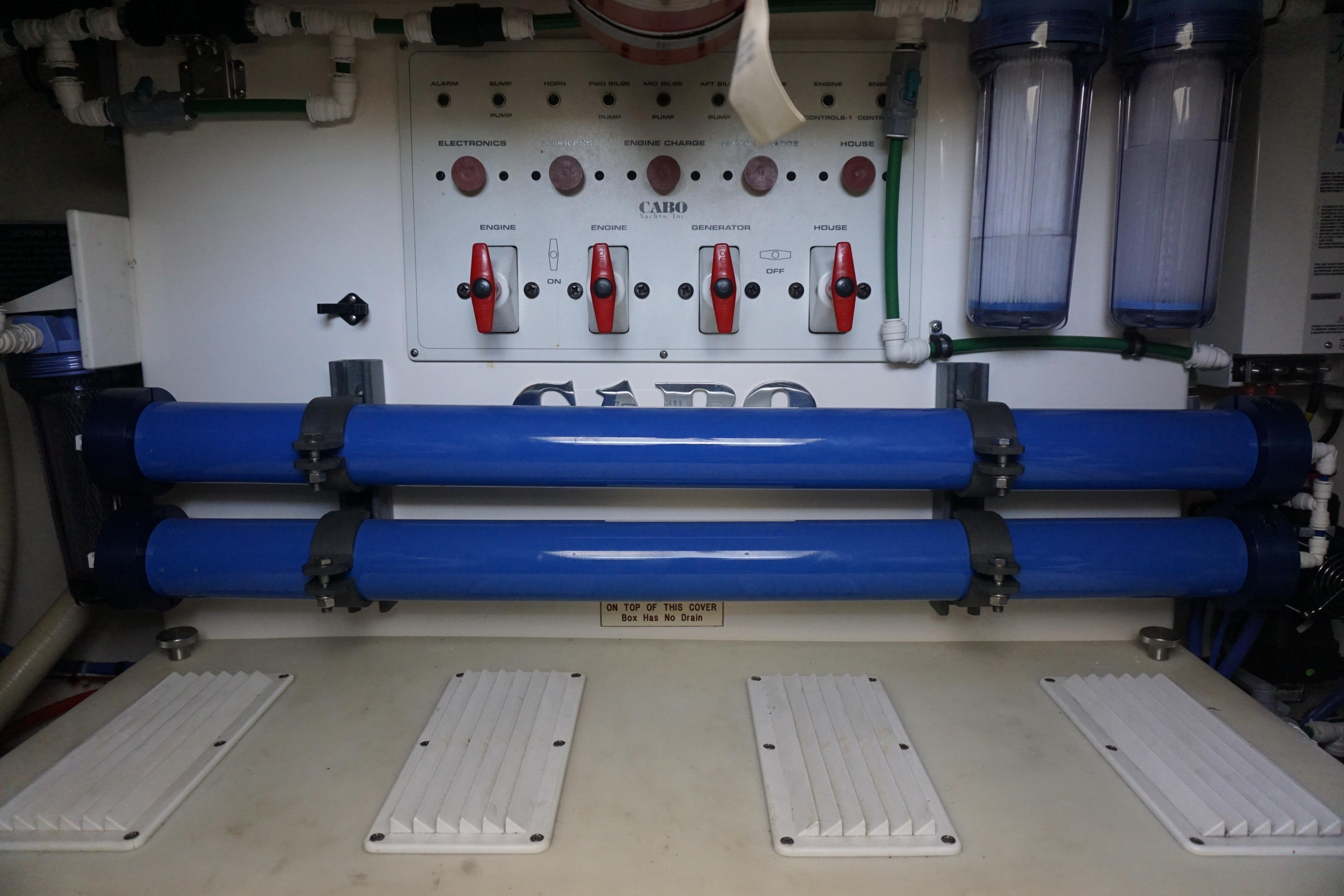 Electrical panel and filtration system in a 2005 Cabo 35 Express boat.