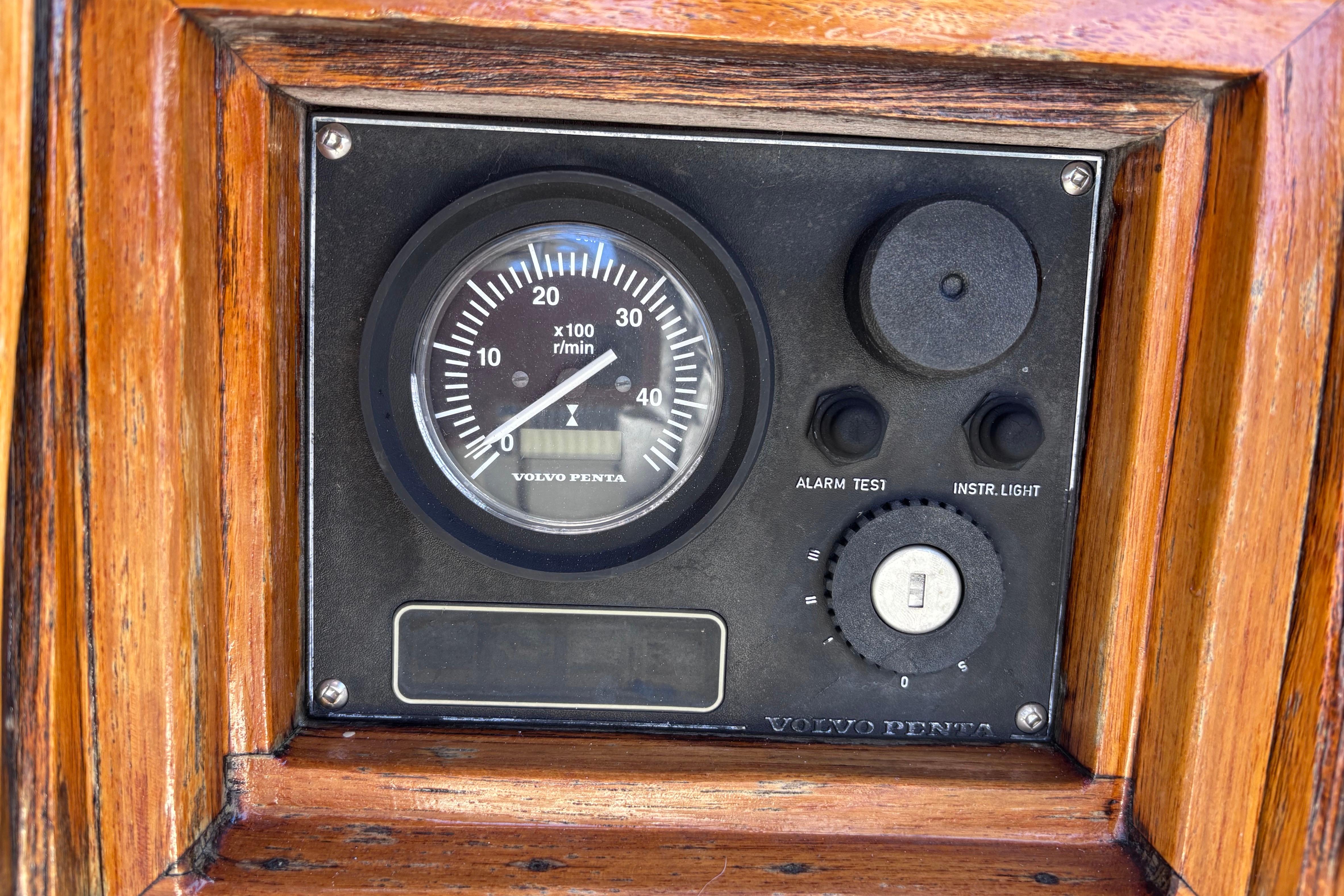 Vintage Volvo Penta tachometer on 1978 Swift 33 boat dashboard.