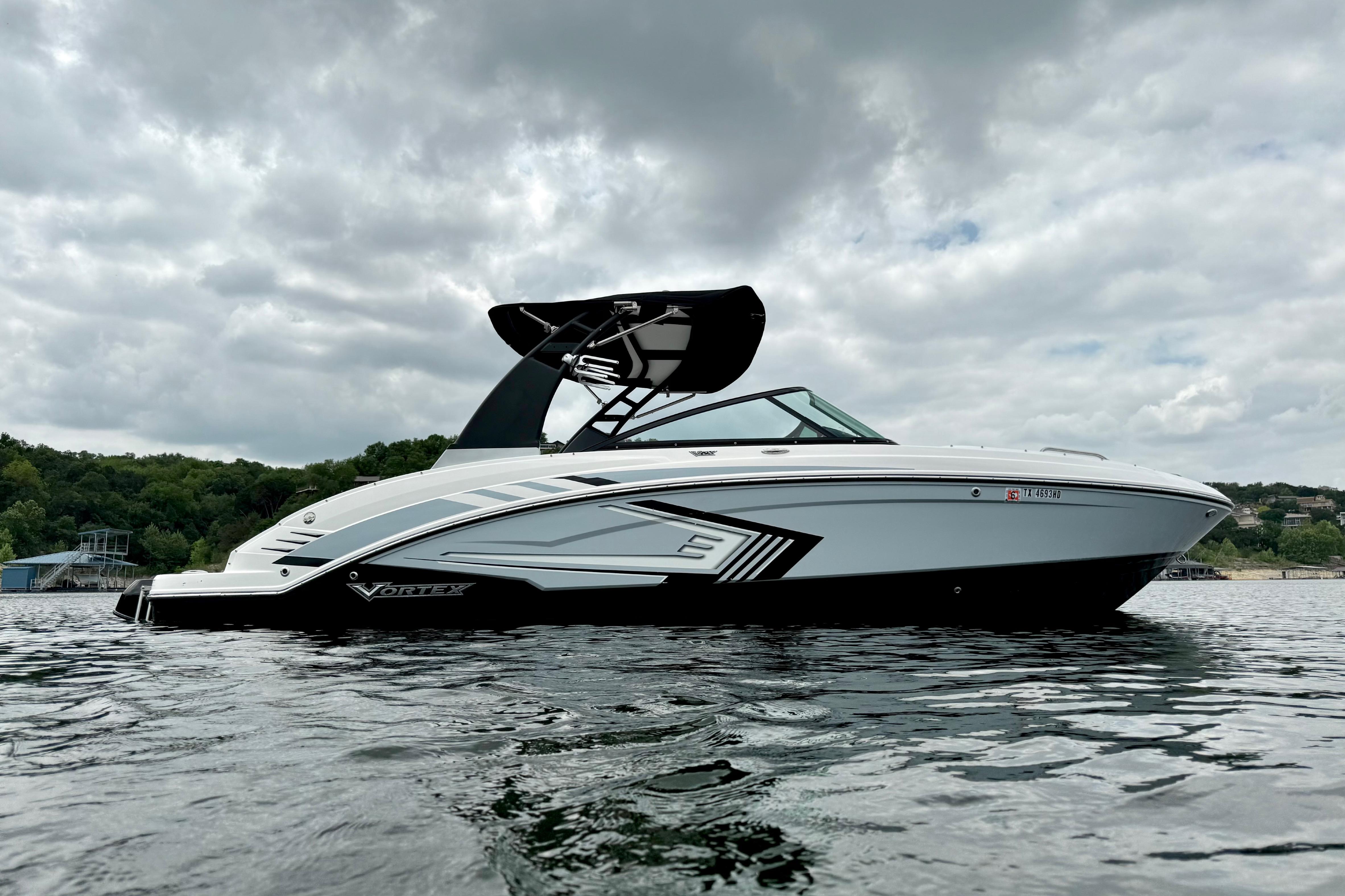 2019 Chaparral Vortex 223 VRX boat on water under cloudy sky.