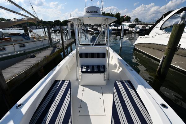 2021 Eastern 248 Center Console boat docked, featuring striped seating and Garmin navigation.