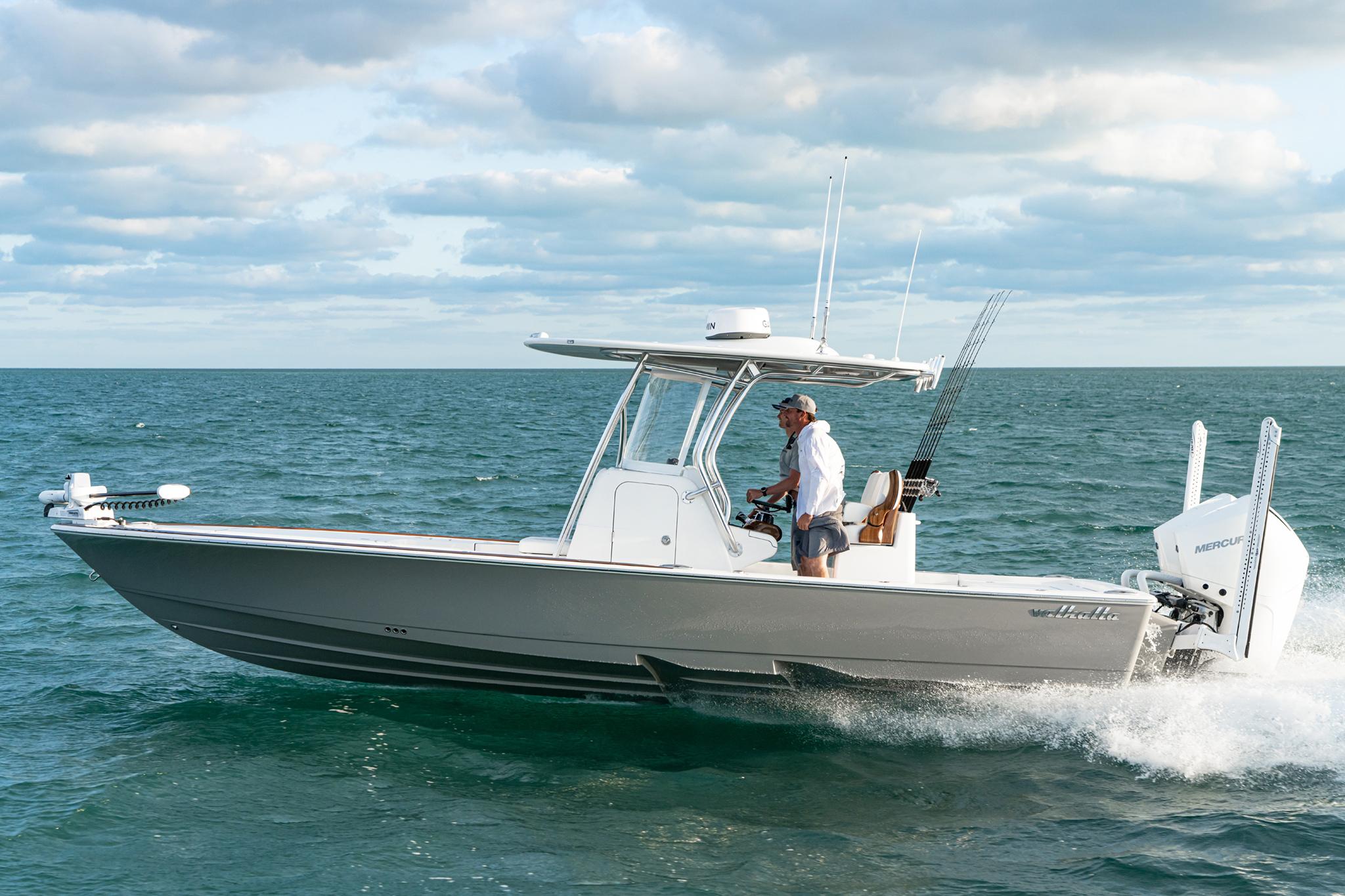 2025 Valhalla Boatworks V-28 Bay cruising on open water under a cloudy sky.