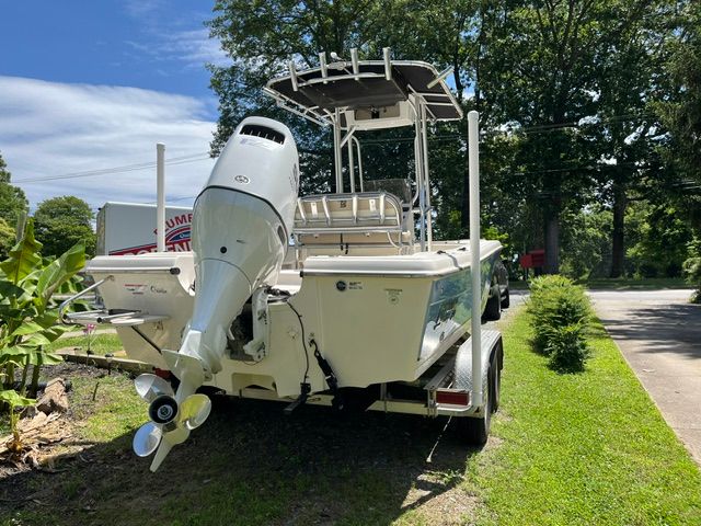 A 2022 Carolina Skiff 21 Ultra Elite boat on a trailer outdoors.