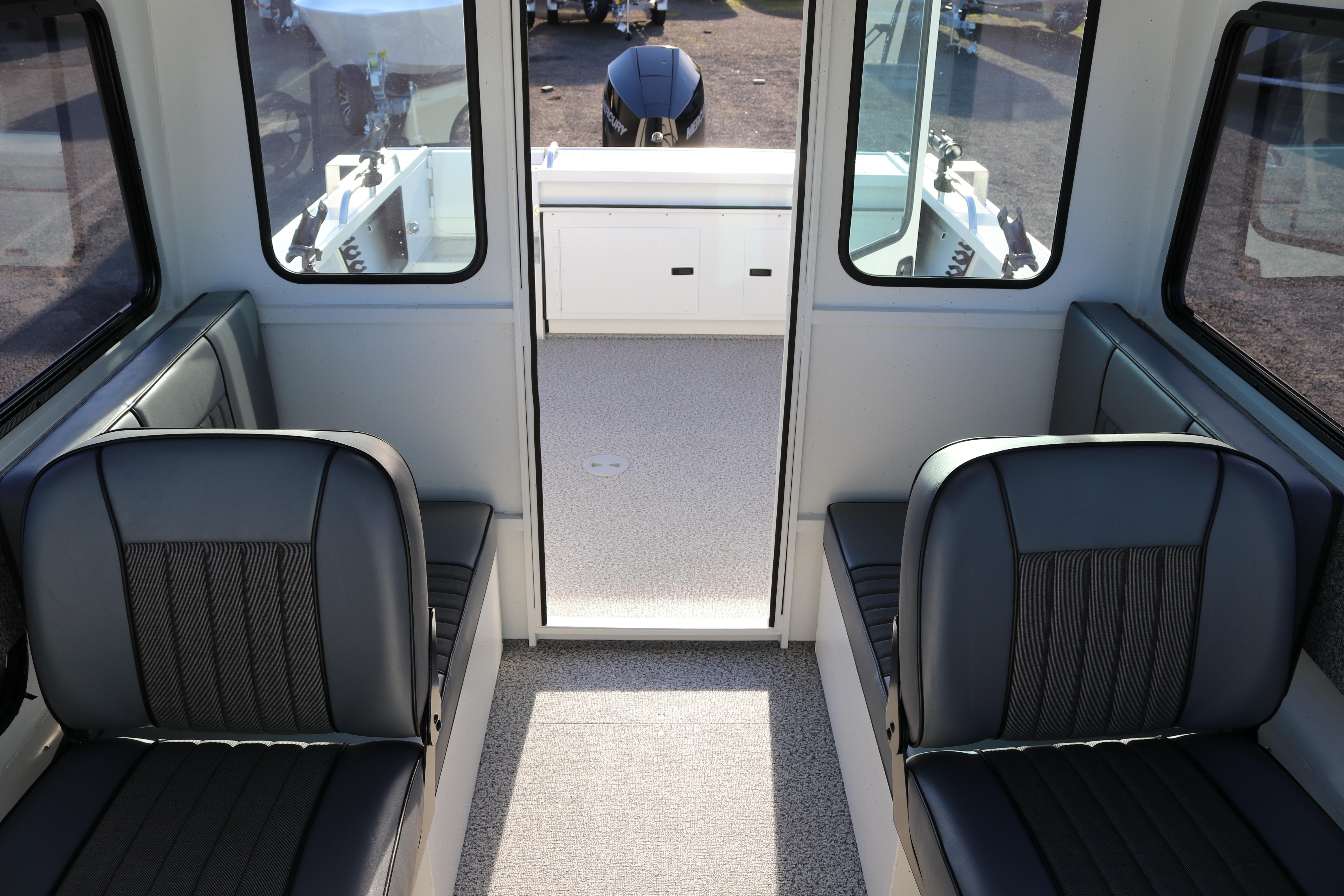 Interior of 2026 Alumaweld Intruder Outboard 22 boat with seating and storage.