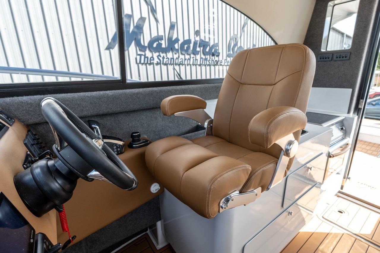 Luxurious helm seat in 2025 Makaira Gen 3 36 boat interior.