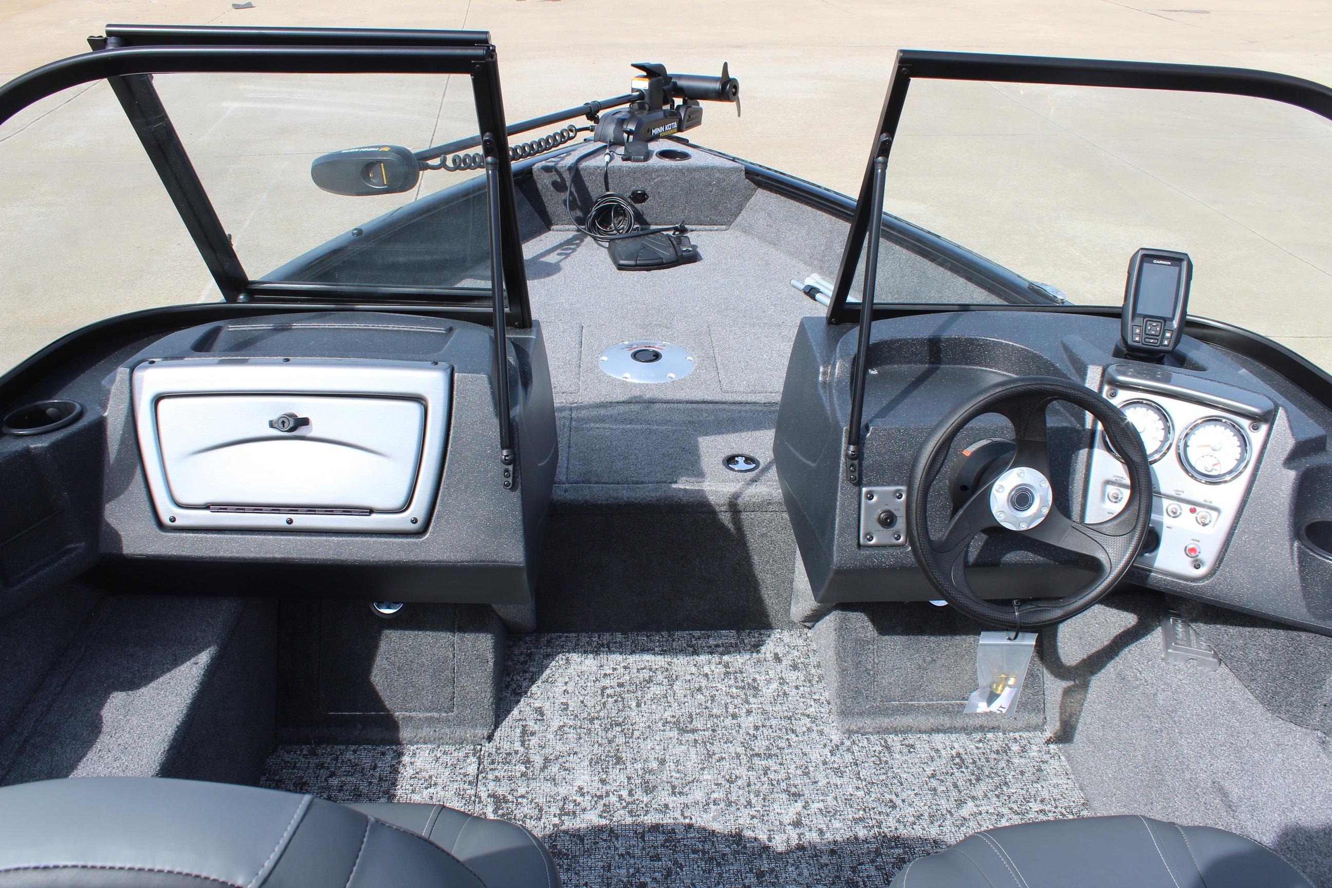 Interior view of 2026 Tracker Targa V-18 Combo boat, featuring steering wheel and dashboard controls.