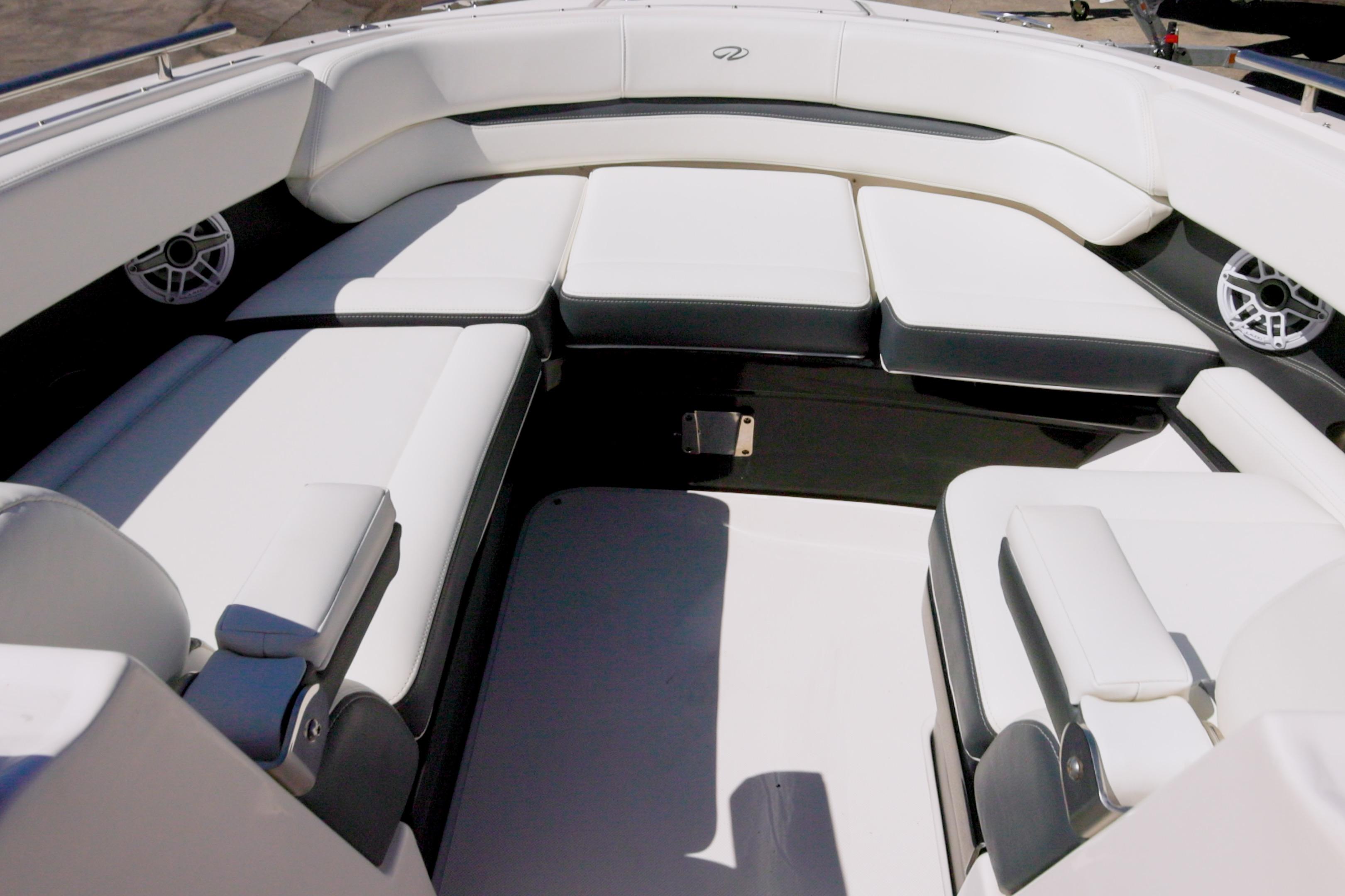 Luxurious seating area on a 2017 Regal 29 OBX boat, featuring white upholstery.