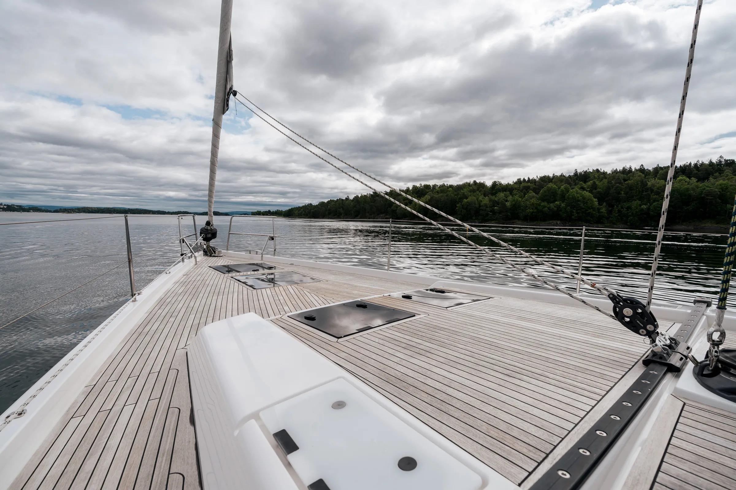 2019 Hanse 548 yacht deck with scenic water and forest view.