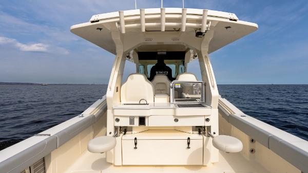 2025 Scout 425 LXF boat on open water, featuring spacious deck and modern design.