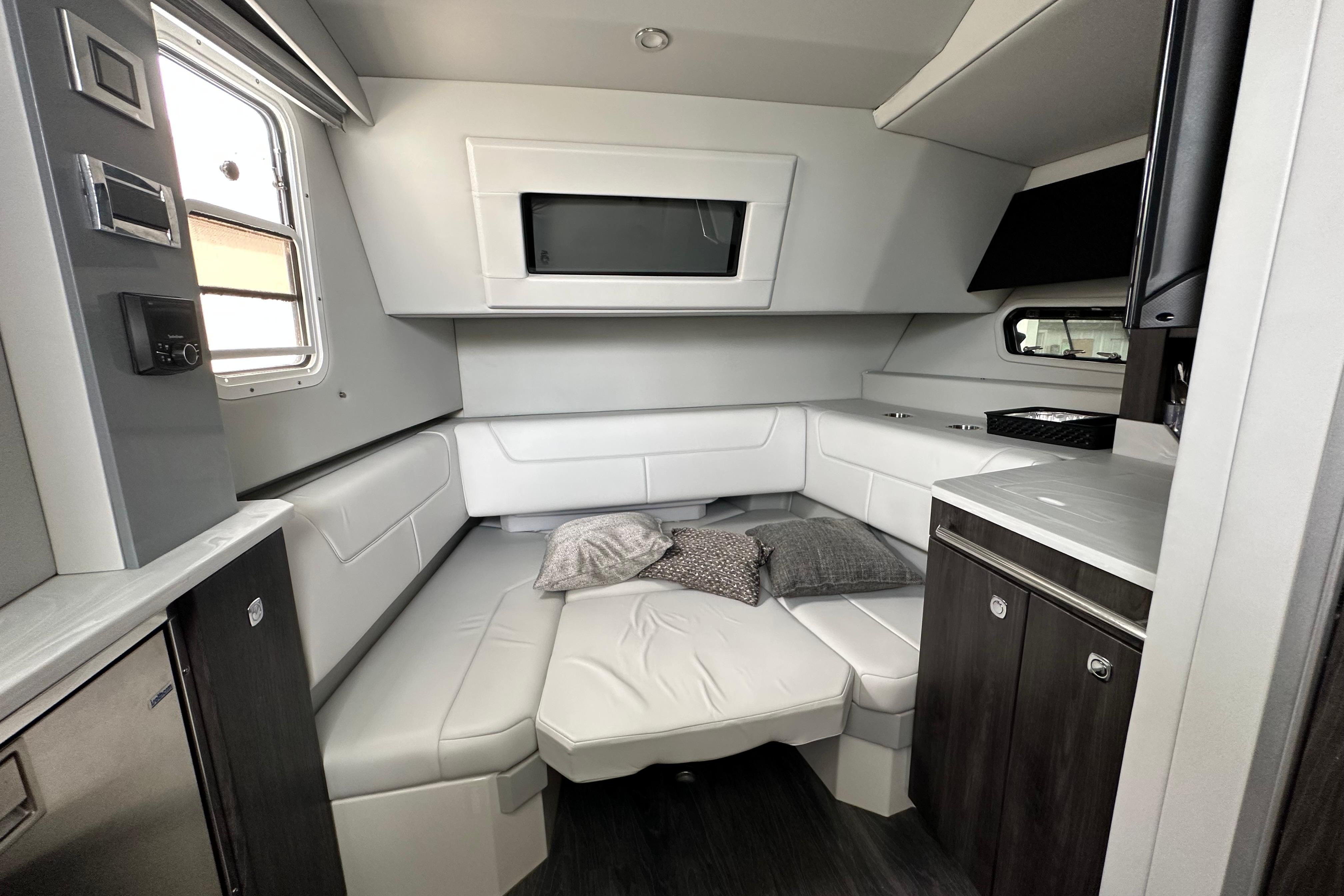 Interior of 2021 Formula 380 Super Sport Crossover OB, featuring modern seating and cabinetry.