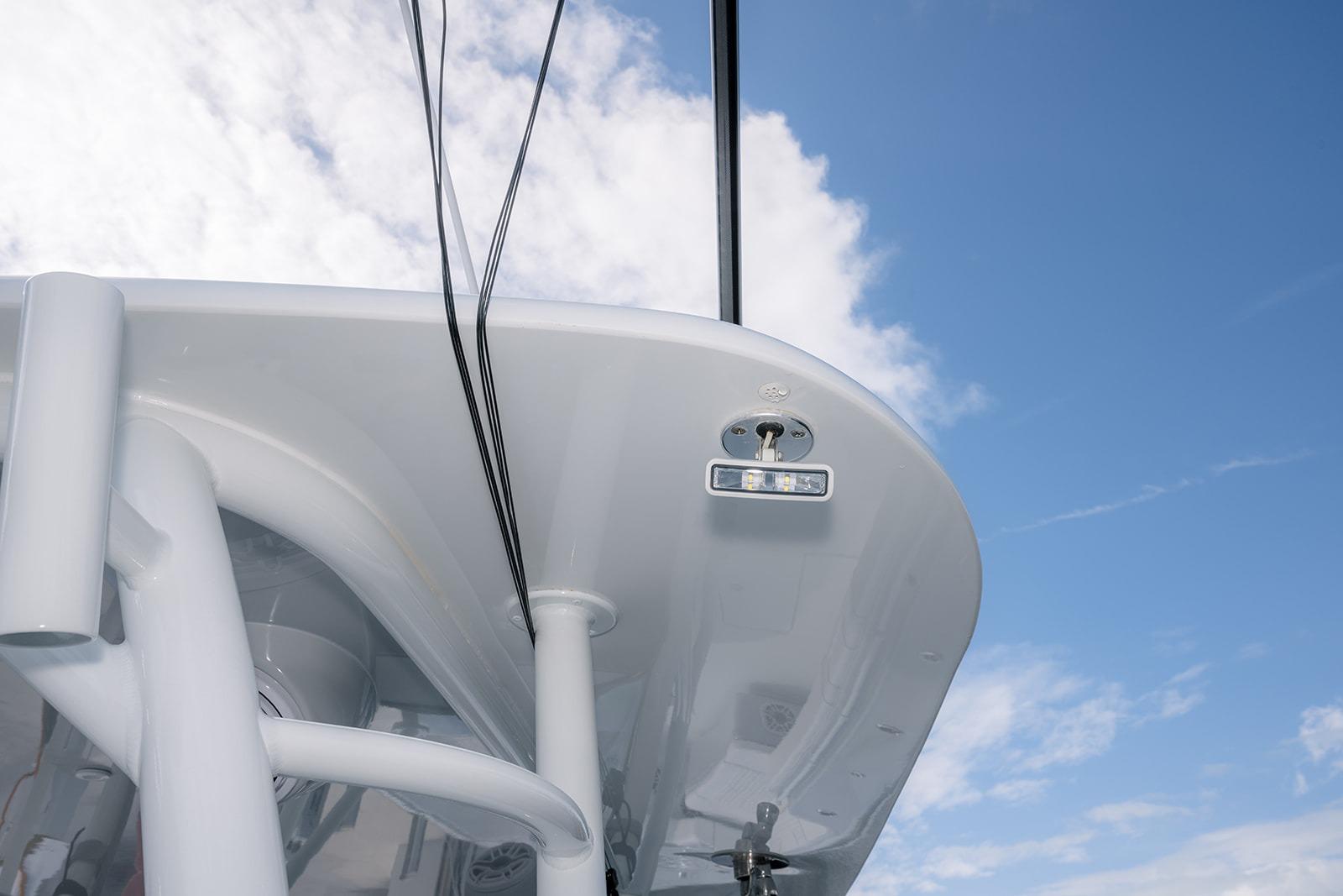 2024 Contender 44 ST boat detail against a blue sky background.