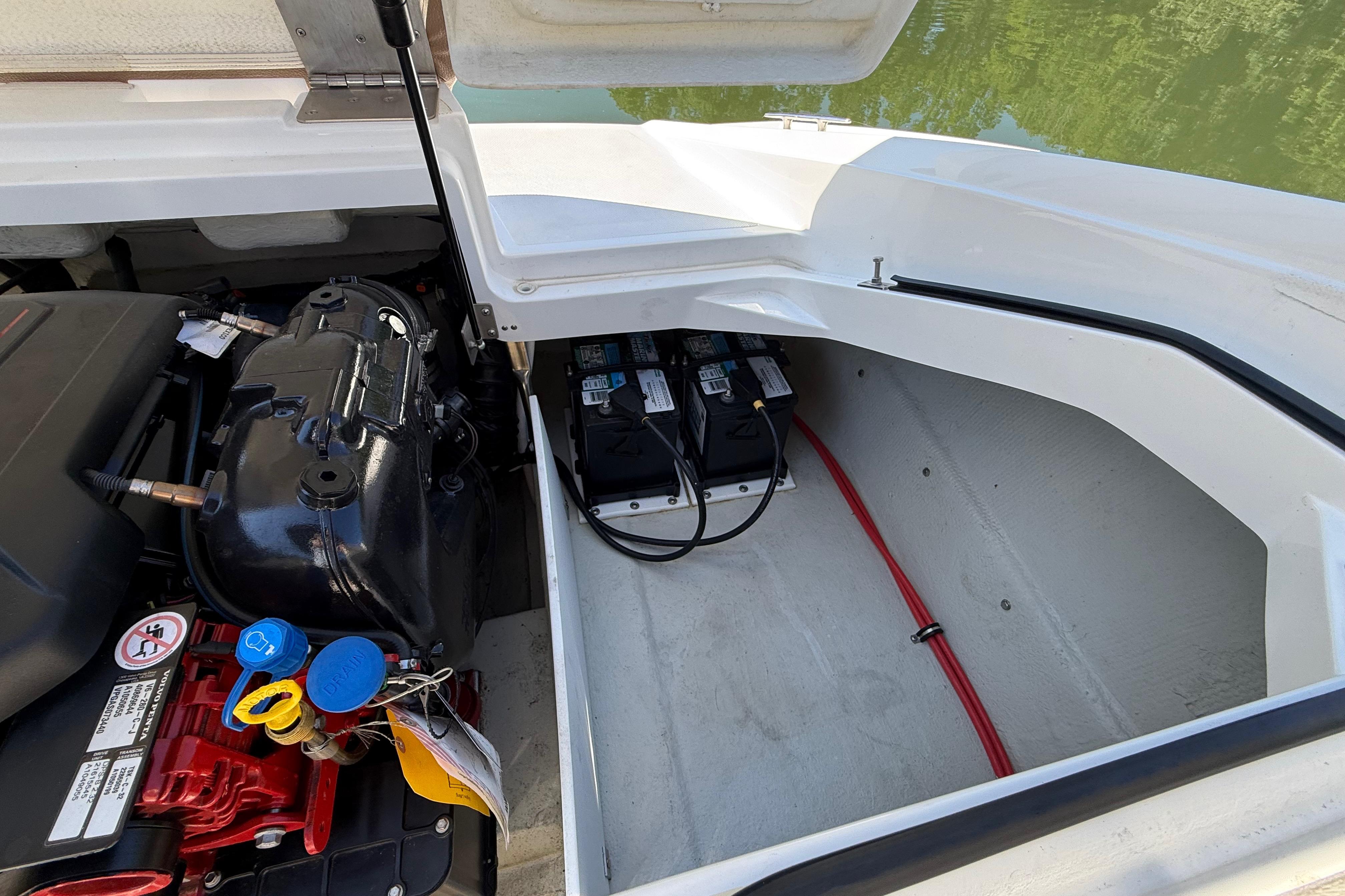 2018 Cobalt CS22 boat engine compartment with batteries and wiring.