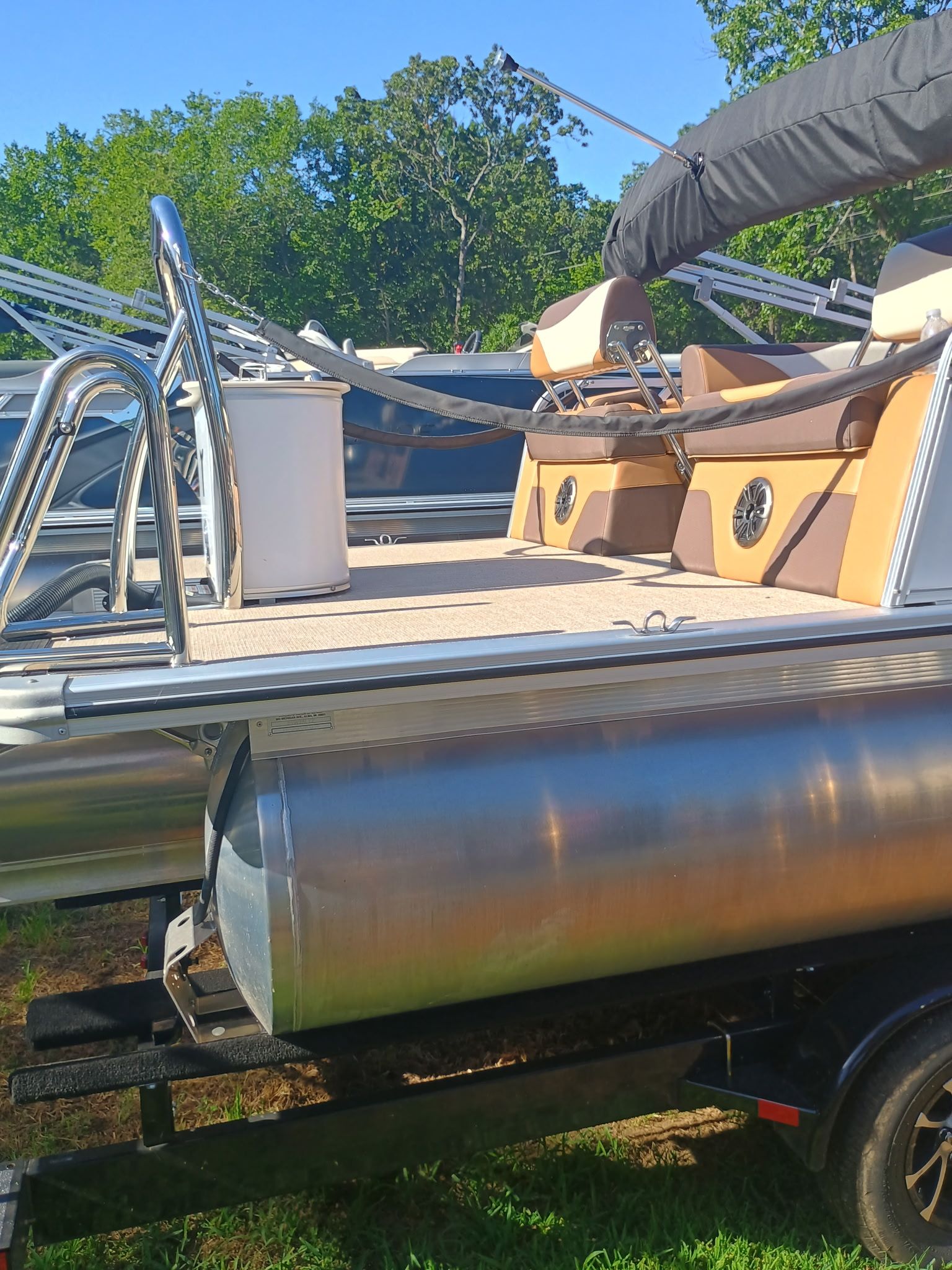 2025 Tahoe LTZ Quad Lounger Shift pontoon boat on trailer.