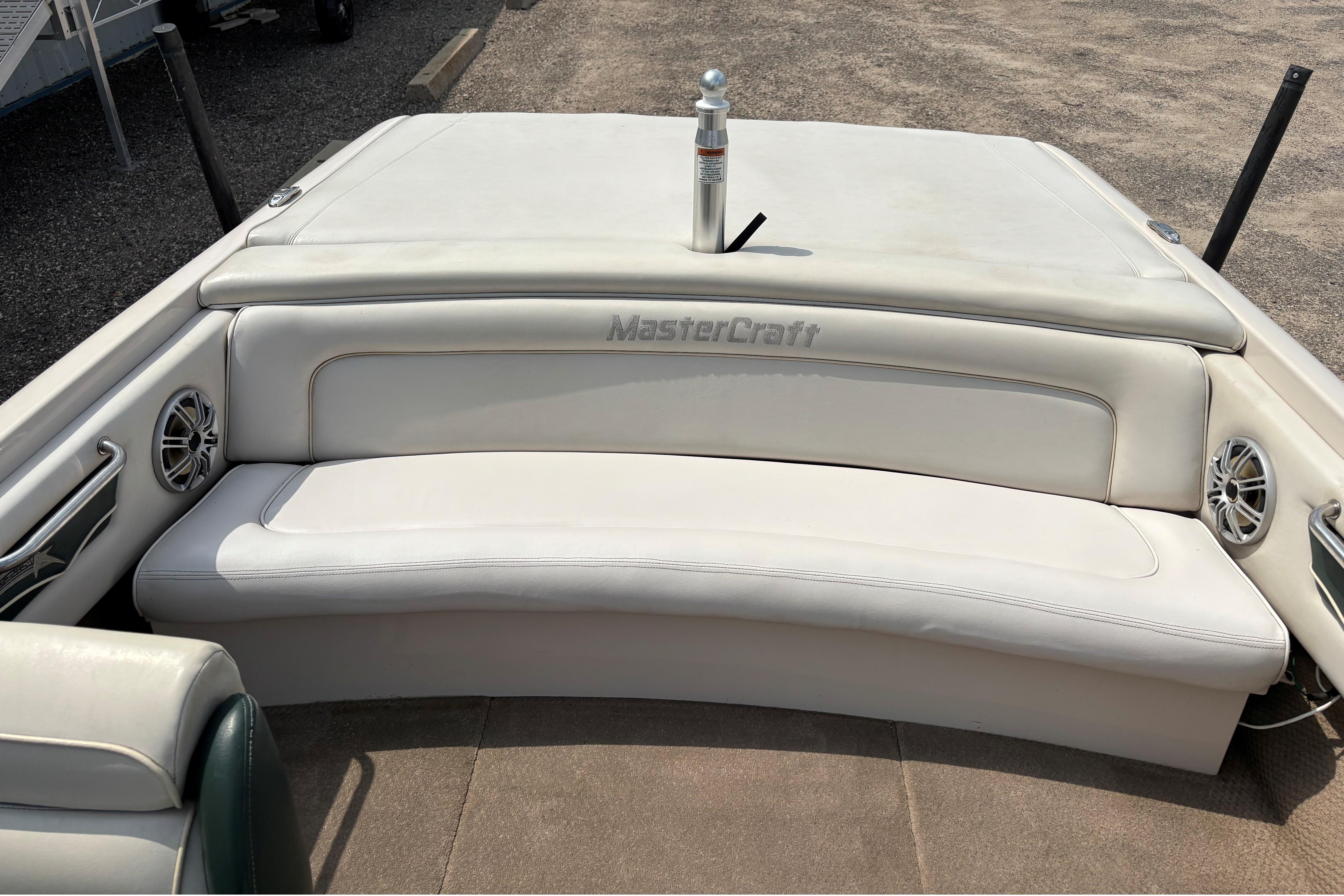 1999 MasterCraft 205 PRO STAR boat interior with white seating and branded upholstery.