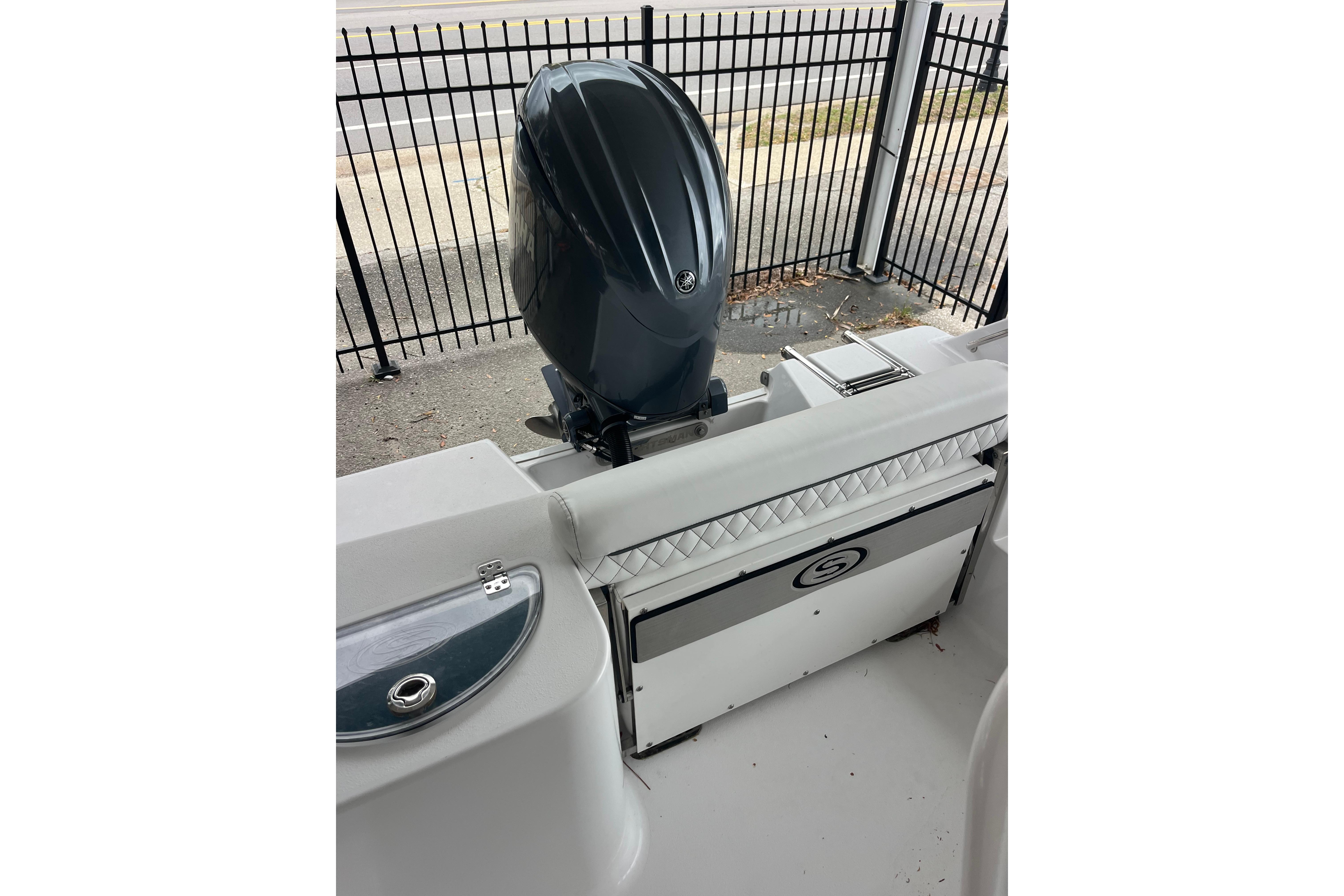 2024 Sportsman Open 212 Center Console boat with outboard motor and seating.
