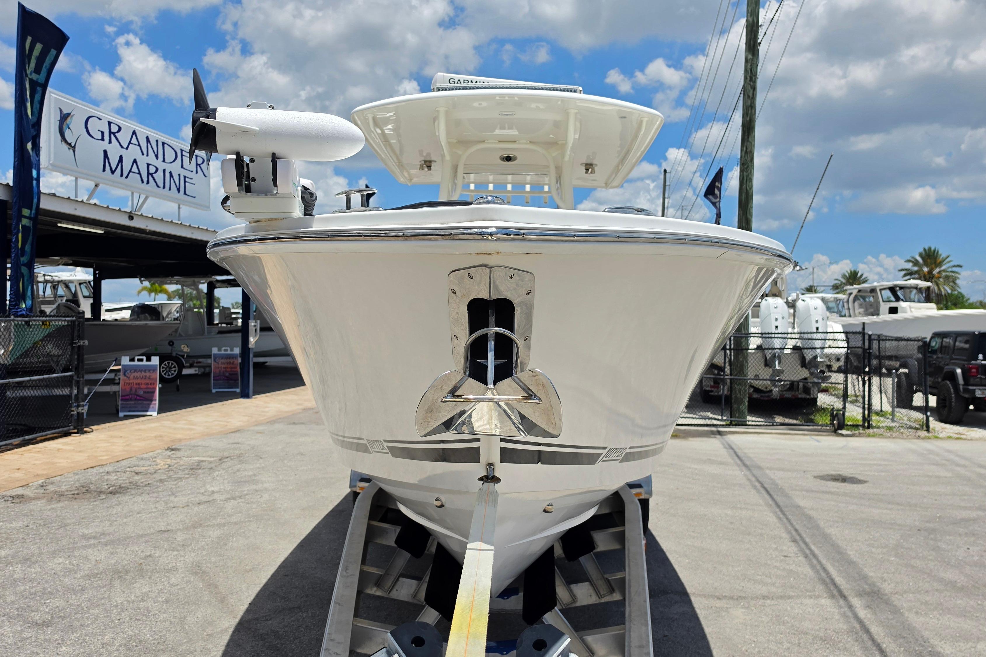 2020 Jupiter 34 HFS boat at Grander Marine dealership under a blue sky.