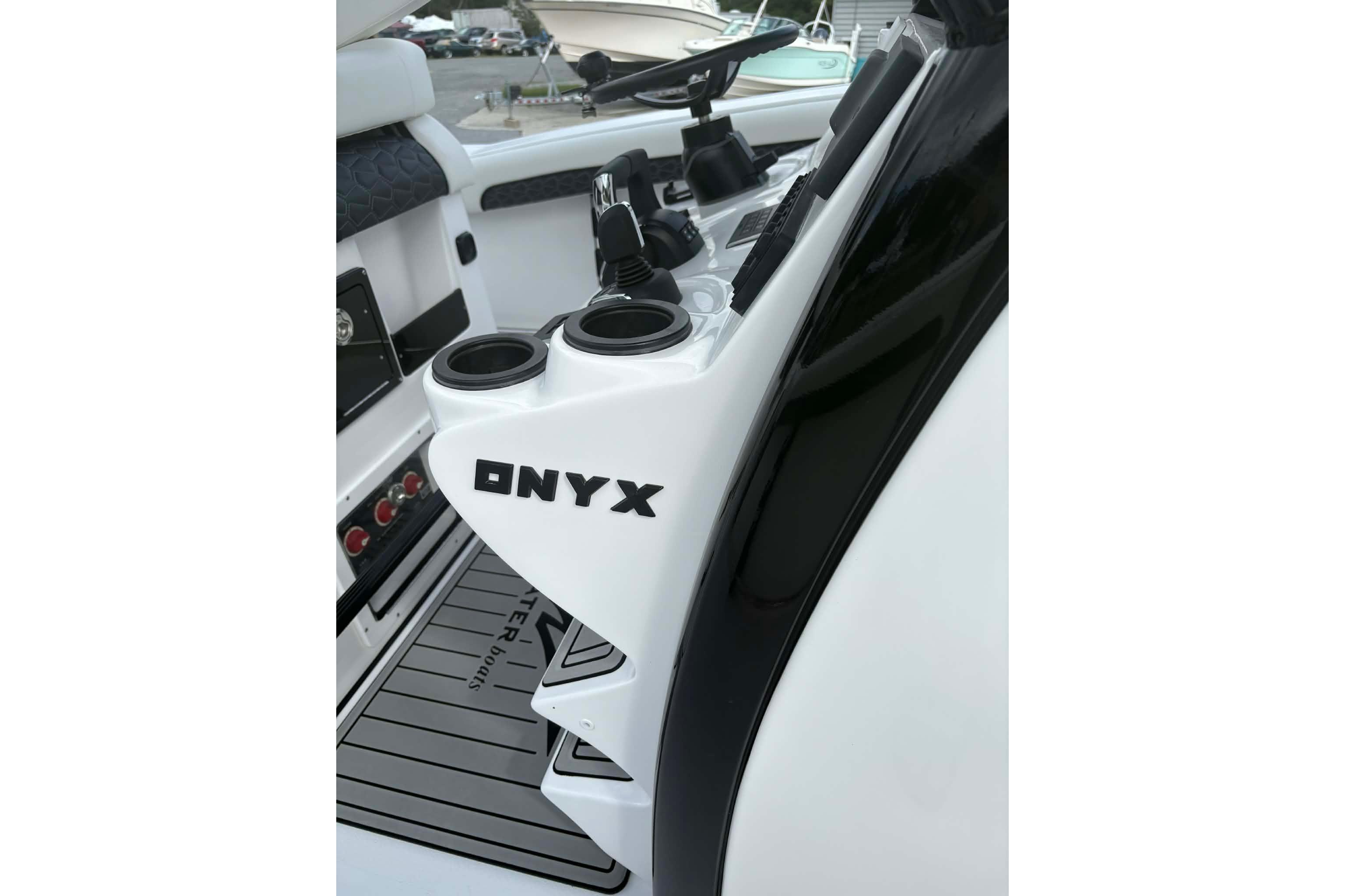2026 Tidewater 282 CC Adventure boat interior with "ONYX" branding and cup holders.