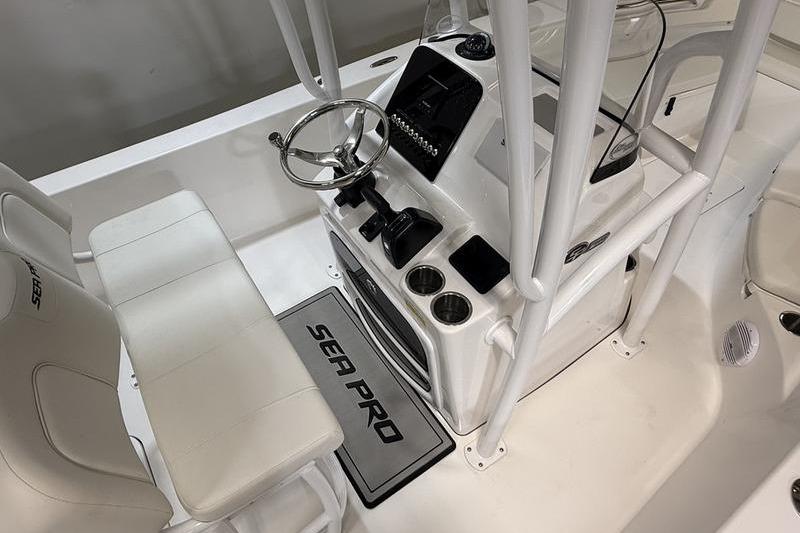 2026 Sea Pro 202 Center Console boat interior with steering wheel and seating.