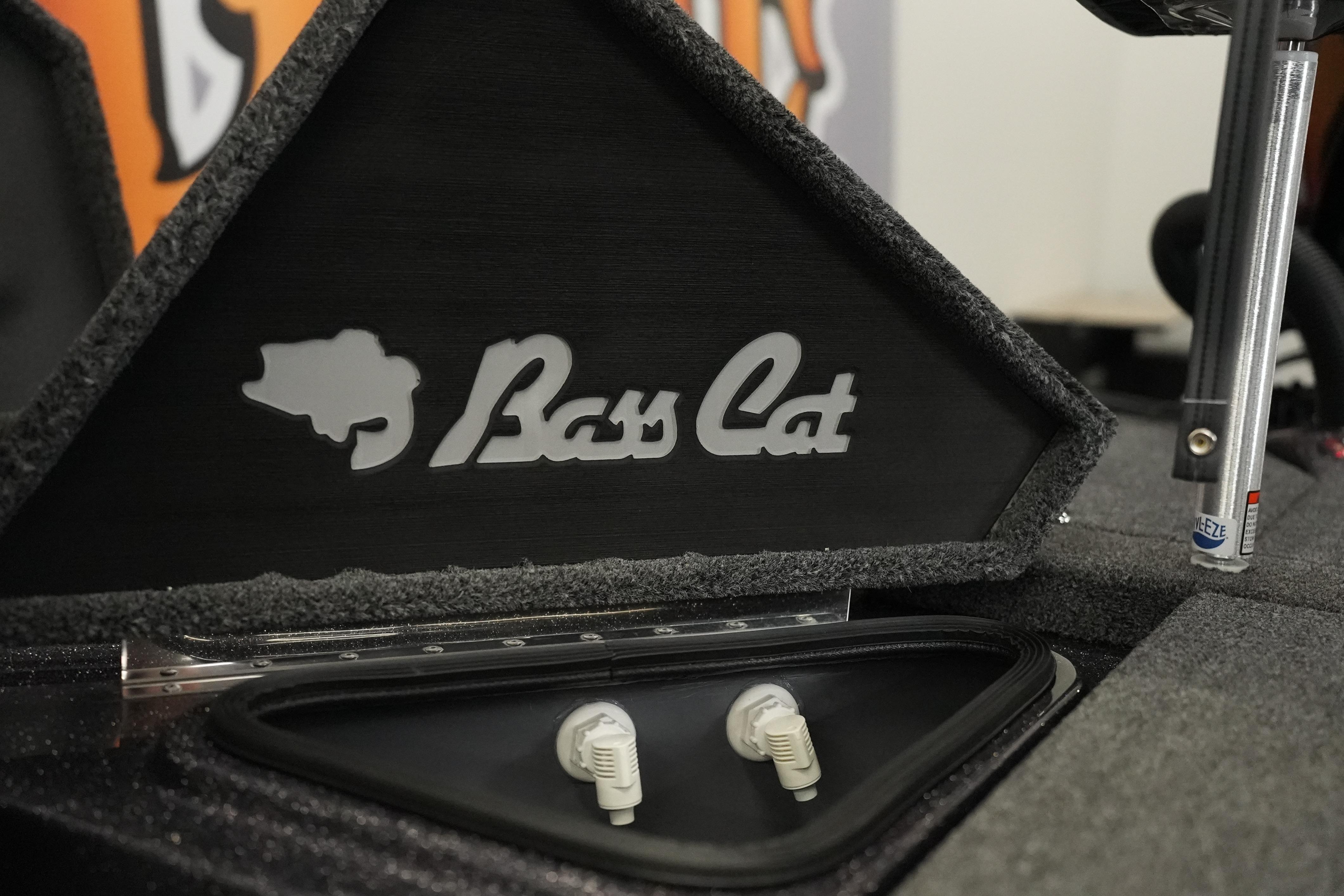 2026 Bass Cat Puma STS logo on boat interior with control knobs.