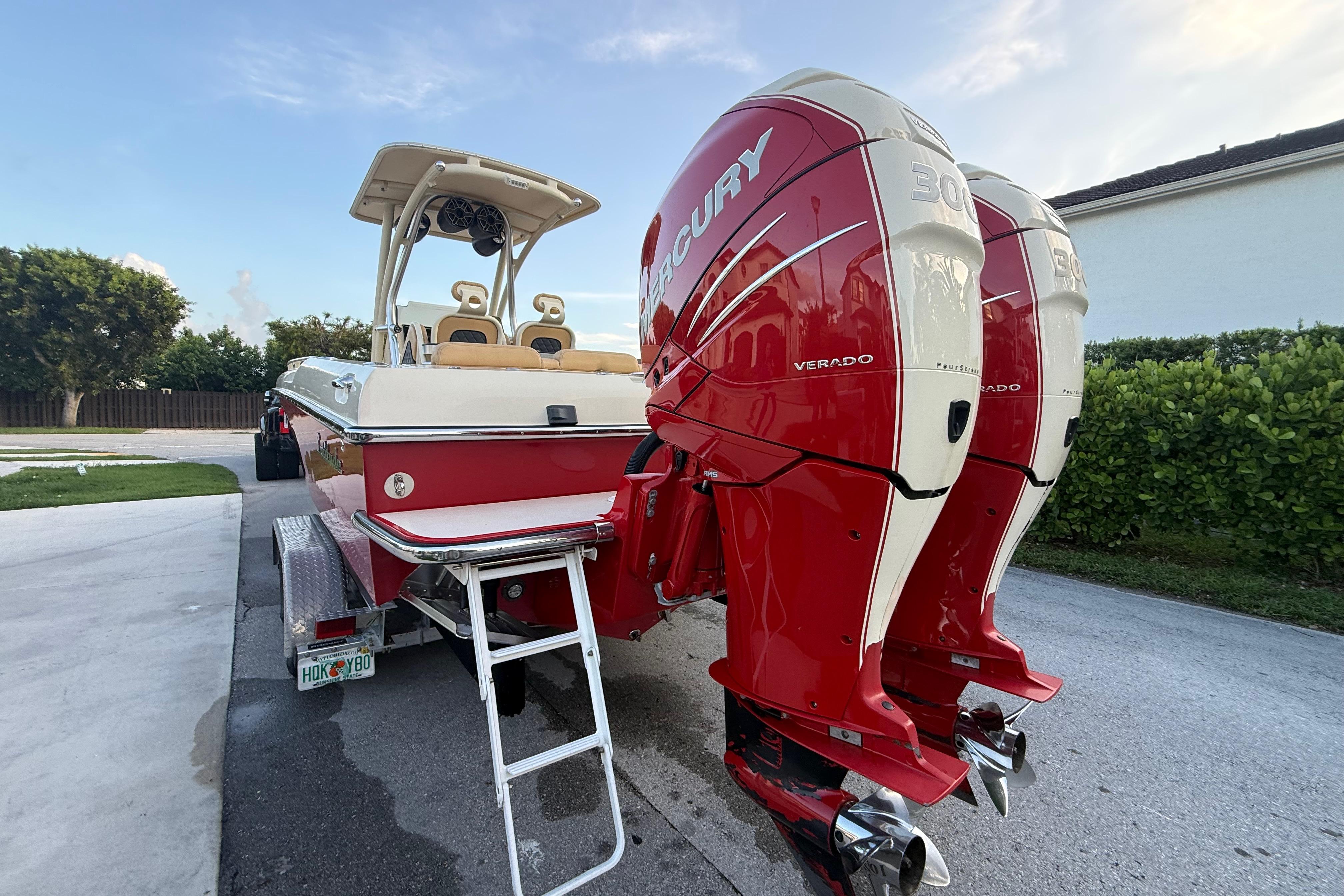2014 Latitude 46 28 CC boat with dual Mercury Verado engines on a trailer.