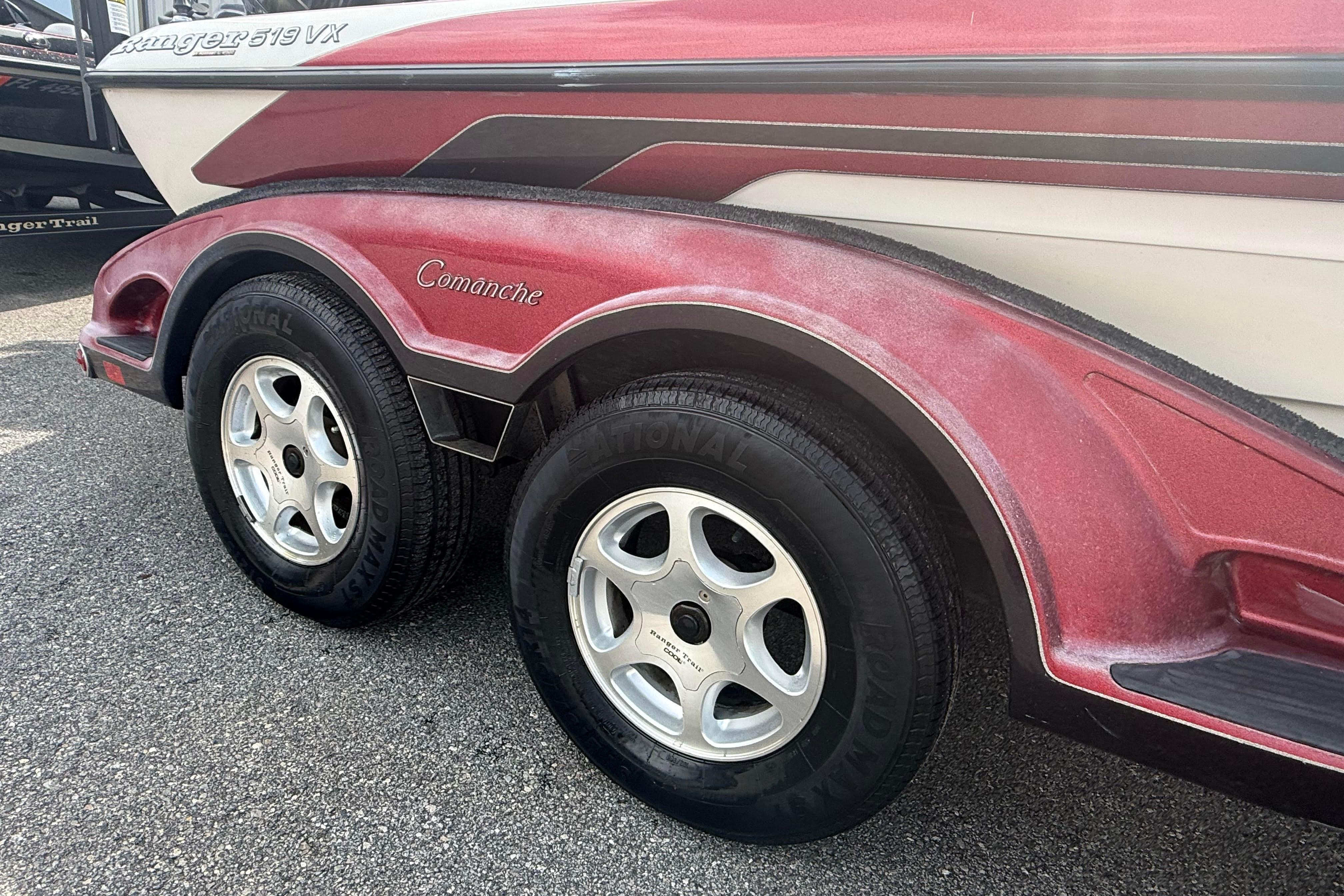 2007 Ranger 519 VX Comanche boat trailer with dual wheels on asphalt.