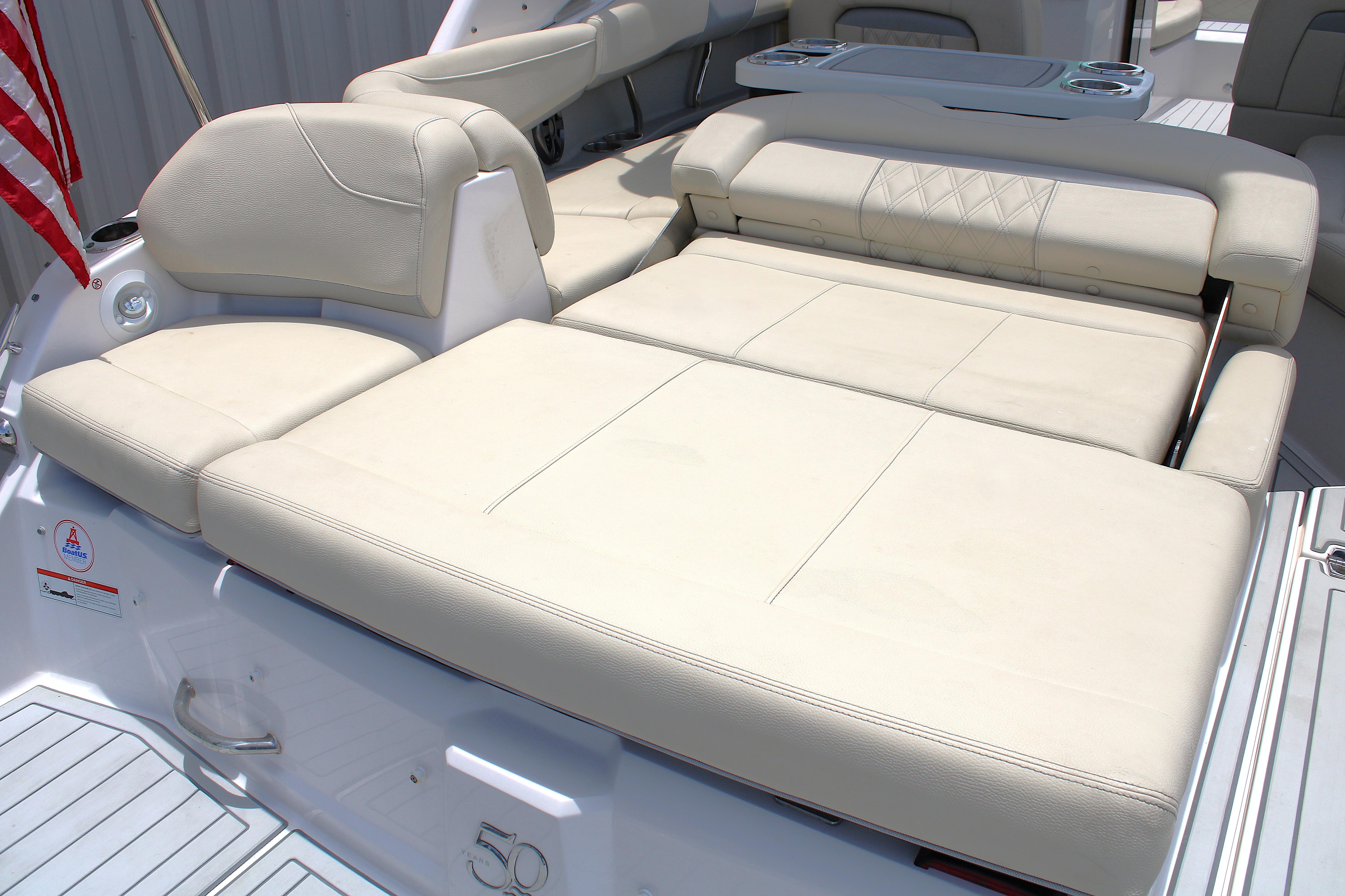 2021 Regal 26 OBX boat with beige leather seating and American flag.