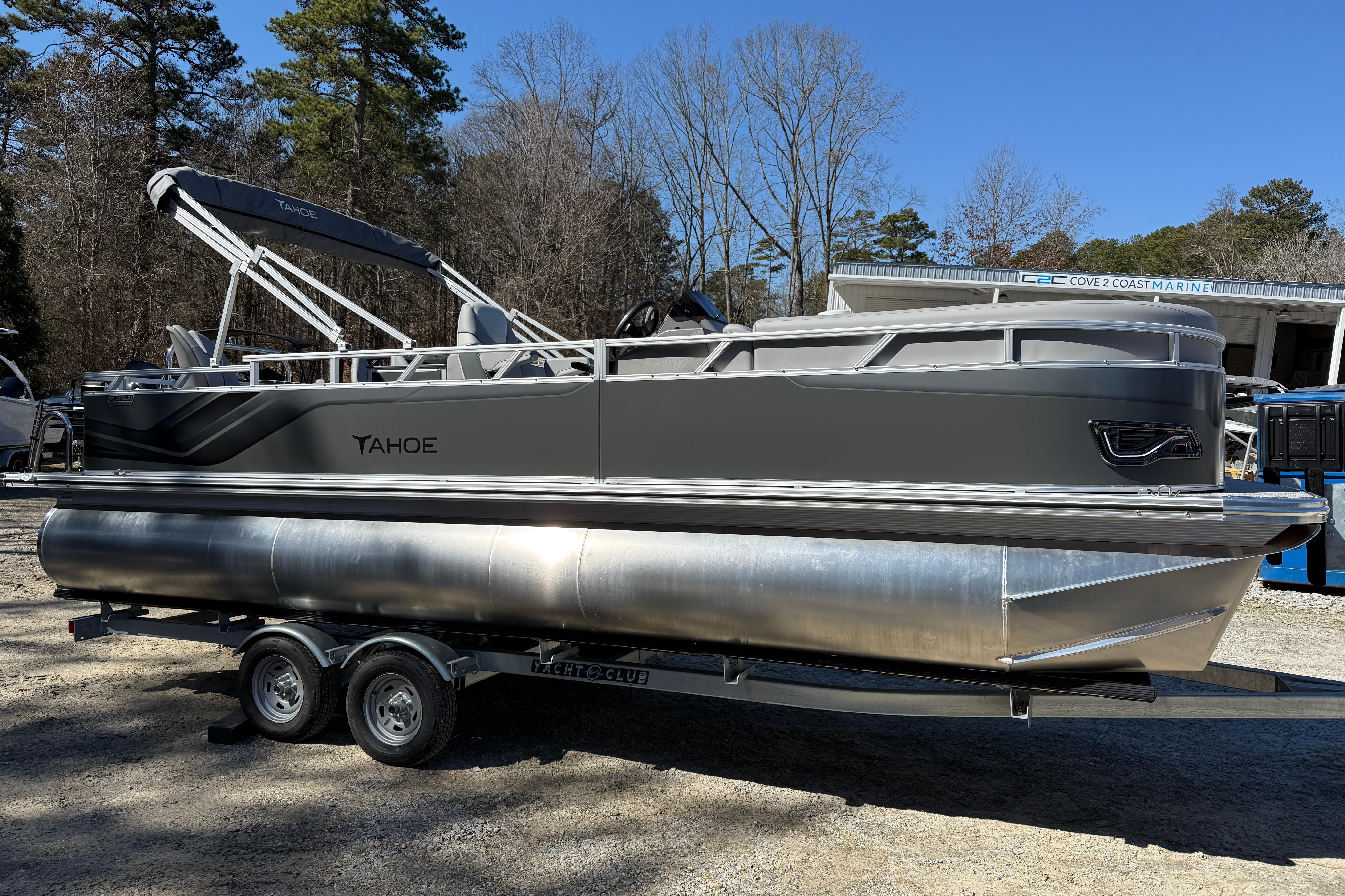2026 Tahoe Pontoon Sport 85 Rear Fish on trailer, parked outdoors.
