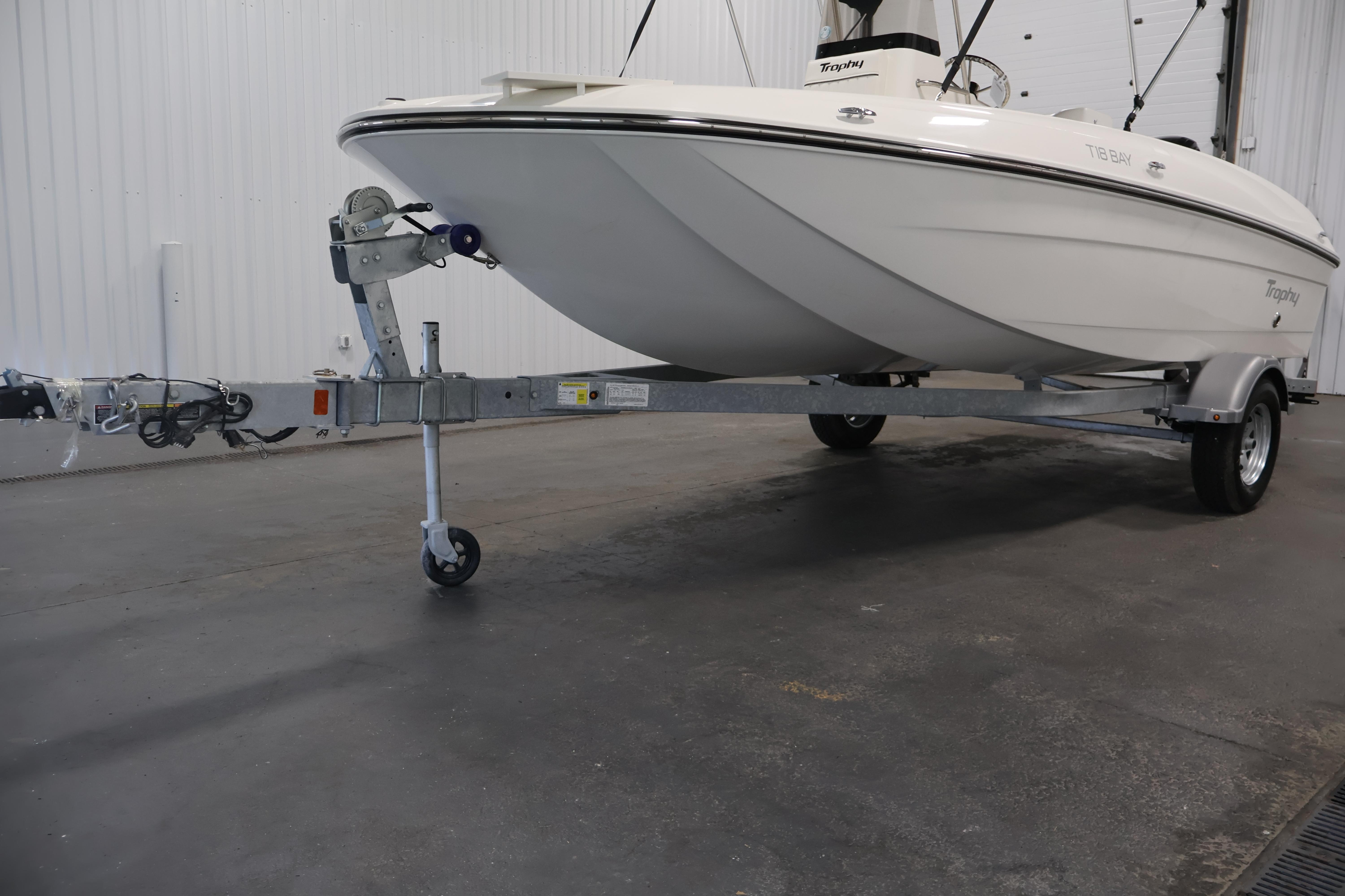 2026 Bayliner Trophy T18 boat on trailer in indoor storage facility.