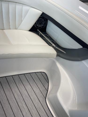 Luxury interior of 2005 Cobalt 343 boat with white seating and cup holders.