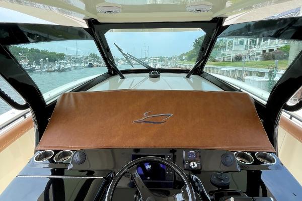 2020 Scout 420 LXF boat dashboard with sleek design and modern controls, docked at marina.