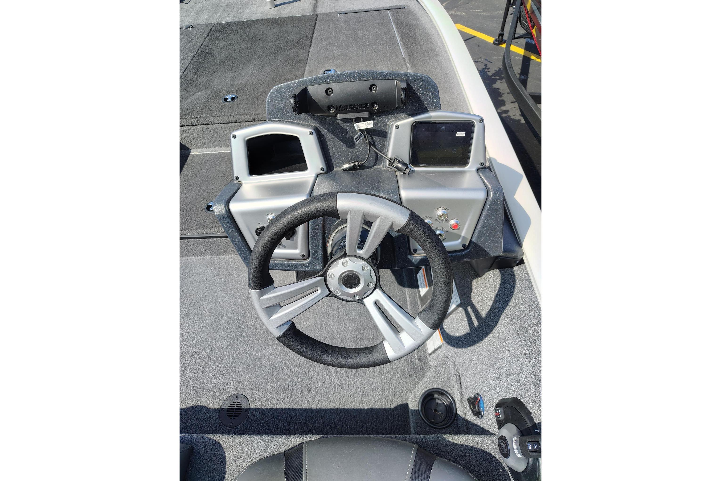 Steering console of 2025 Tracker Savage 215 boat with dual displays and modern controls.