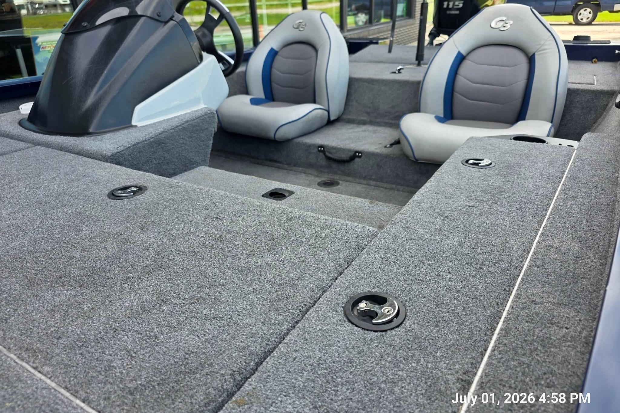 2017 G3 Sportsman 18 boat interior with gray carpet and dual seats.