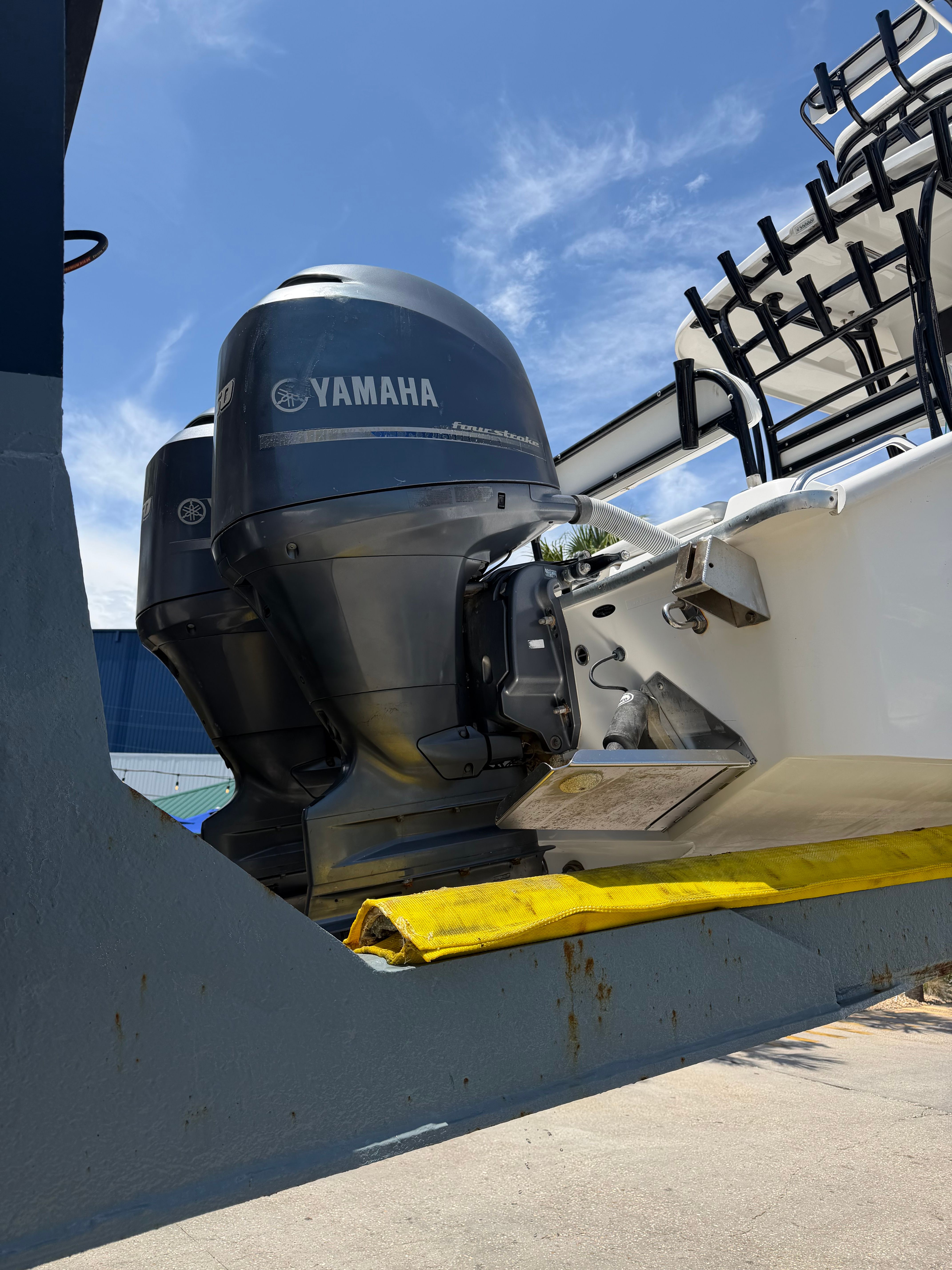 A 2014 Cape Horn 24XS boat with a Yamaha outboard motor.