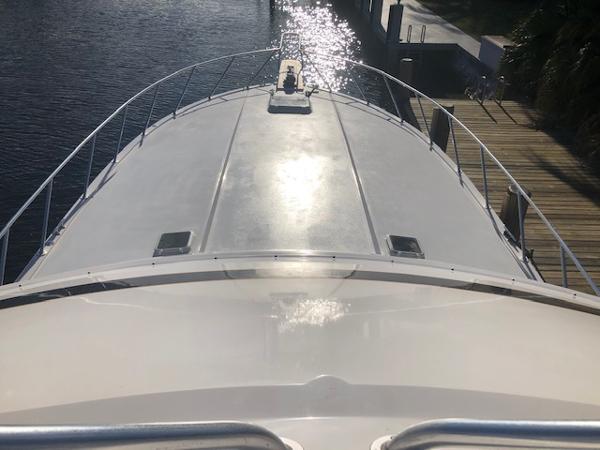 1997 Bertram Convertible yacht bow view at dock.