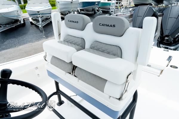 2025 Caymas 281 HB boat seating with dual cushioned seats and steering wheel.