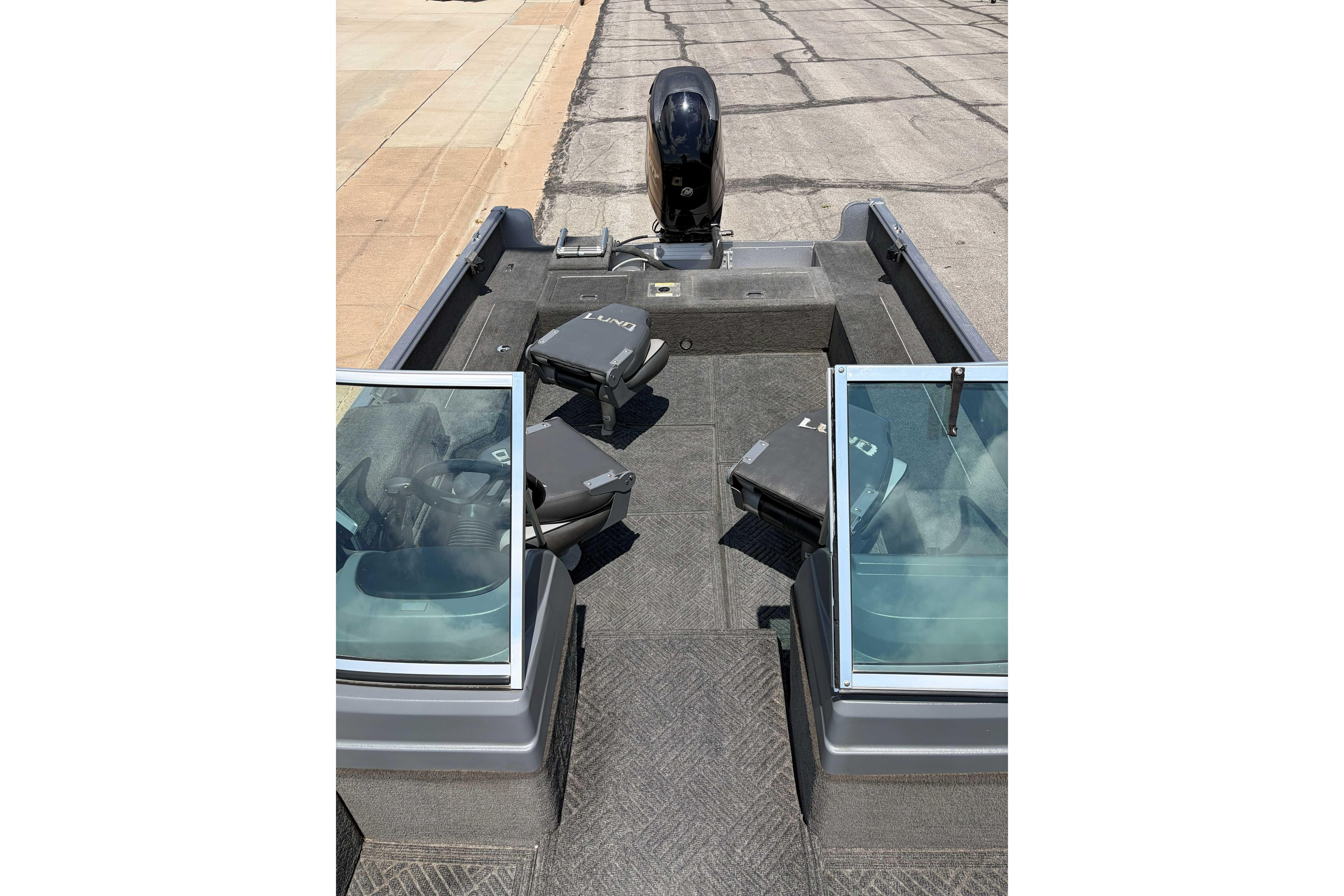 2014 Lund 1875 Impact XS boat interior with seating and windshield.