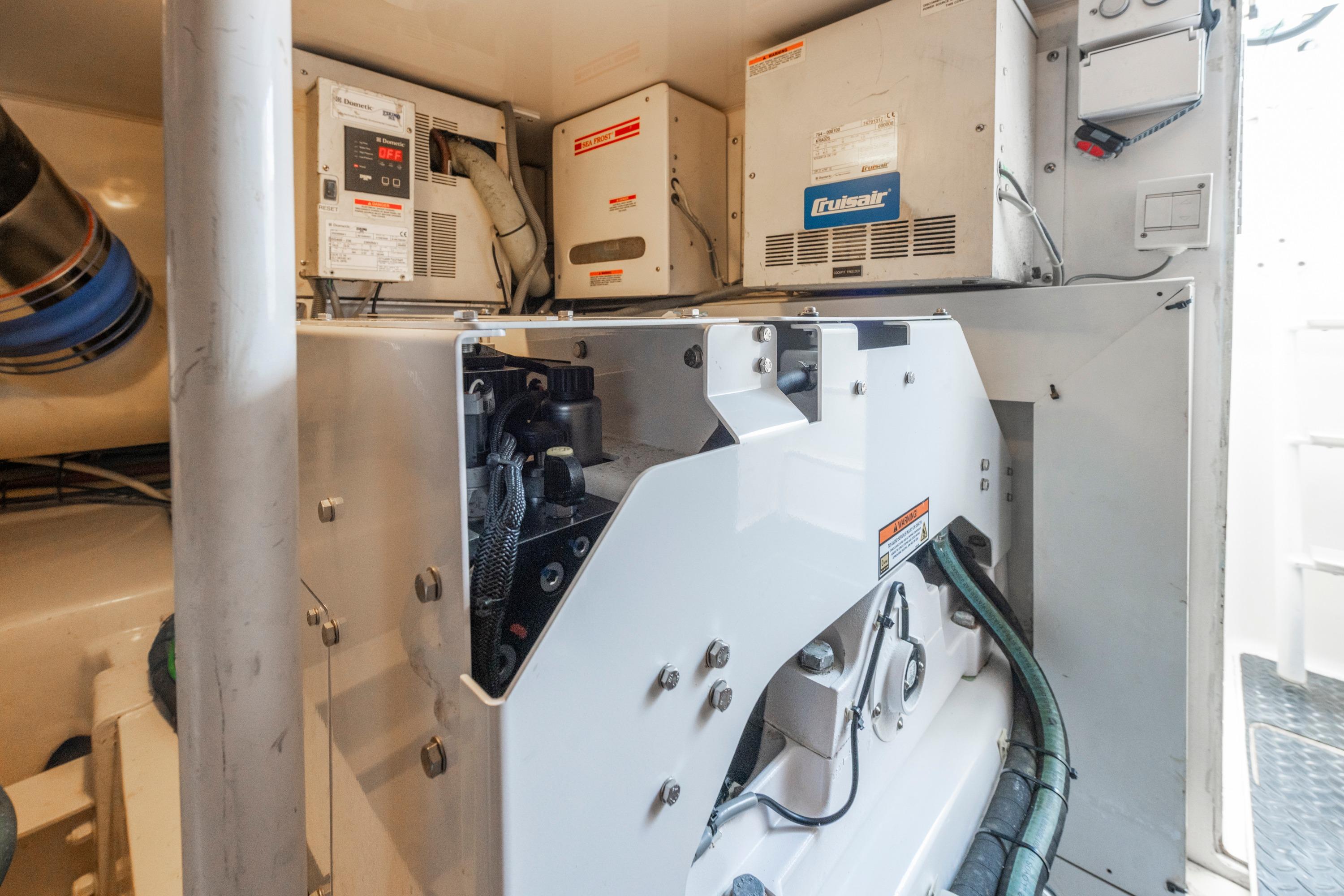 Engine room of 2009 Viking 50 Convertible yacht with mechanical equipment and wiring.
