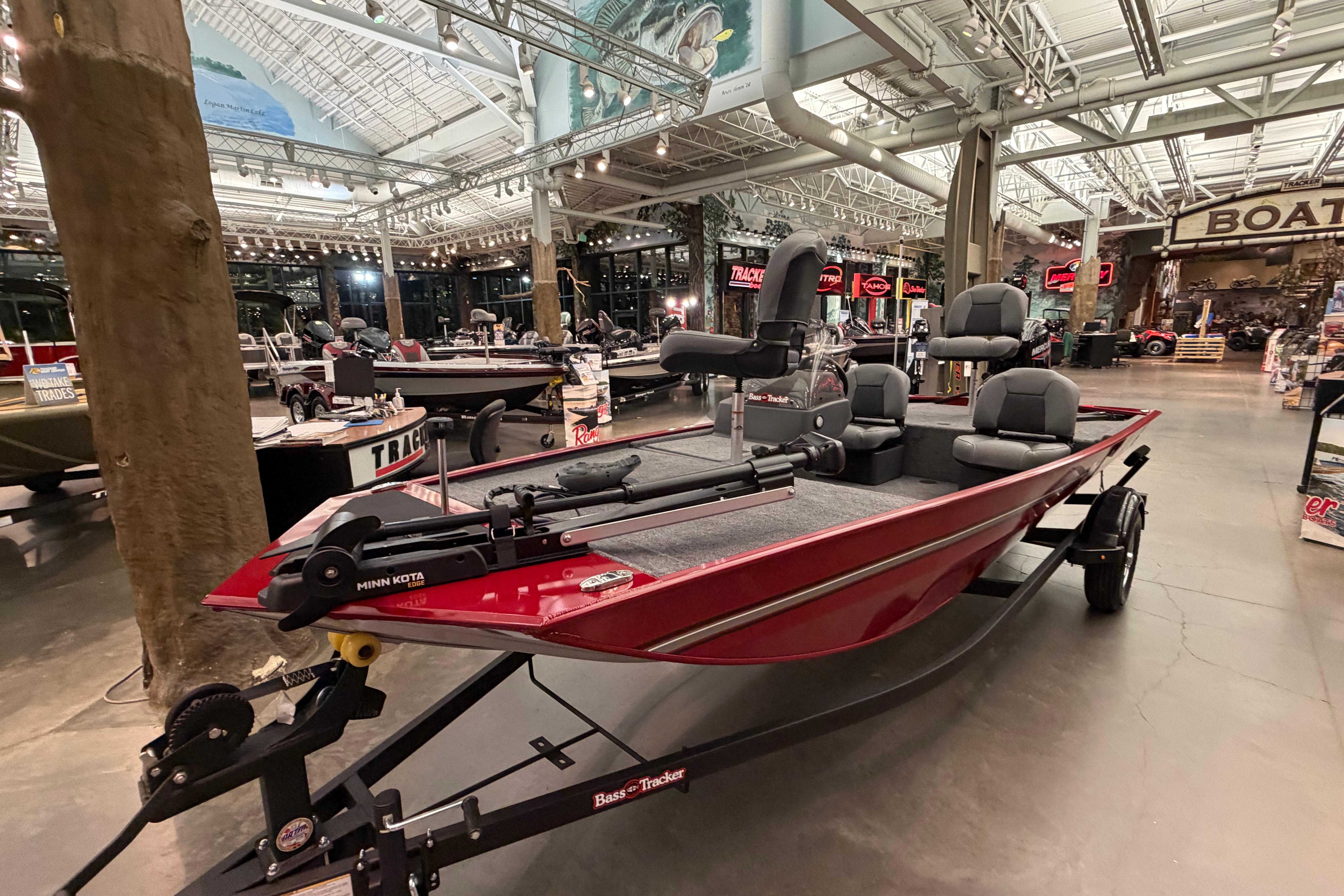 2026 Tracker Bass Tracker Classic XL boat displayed in a showroom with modern lighting.