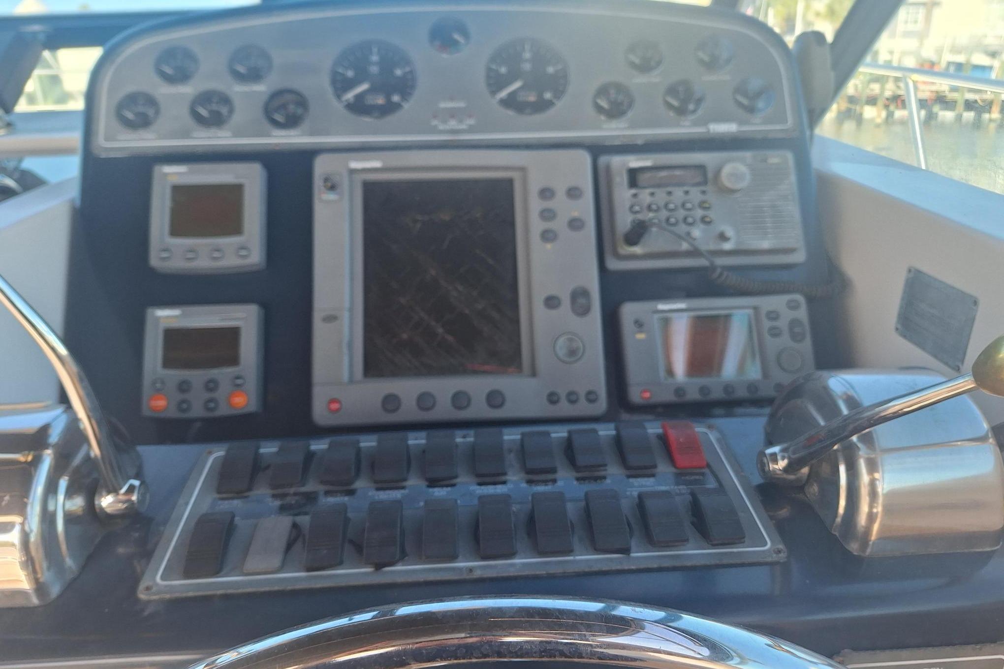 Control panel of a 2002 Tiara Yachts 3500 Open with navigation instruments.